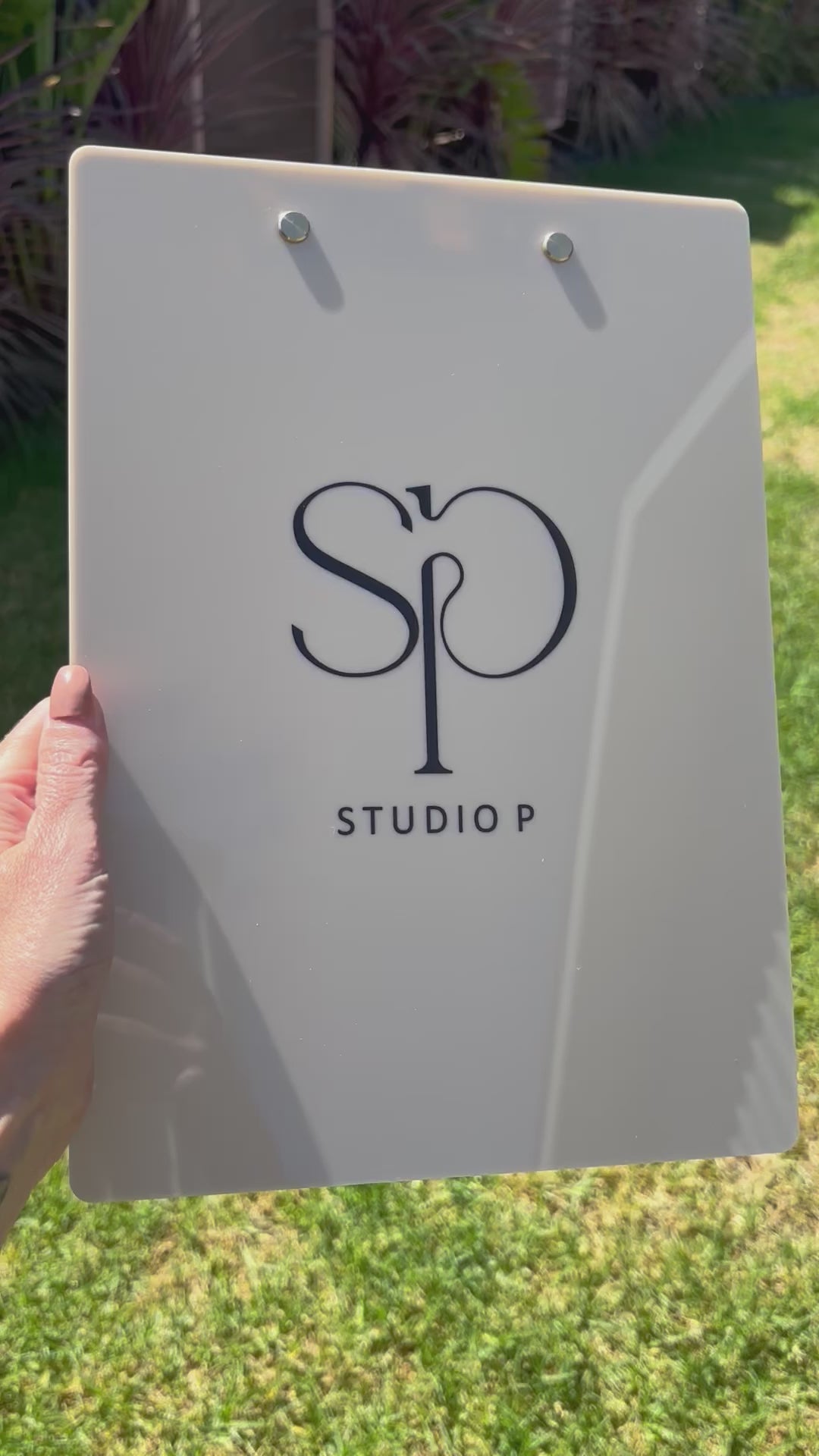 Close up of personalised clipboard with printed logo. Video