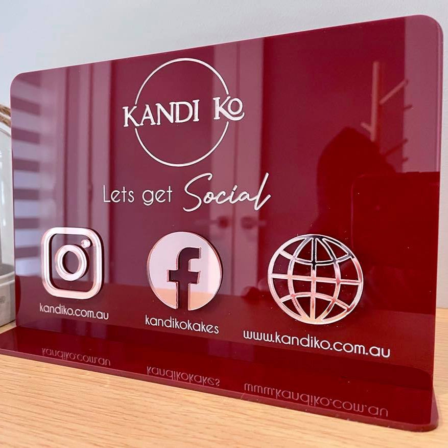 Red acrylic social media stand with business logo, icons and website QR code