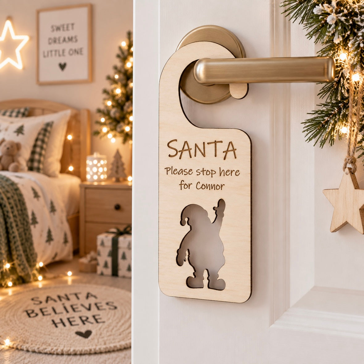 Personalised wooden Santa stop here door hanger for Connor, displayed on a child’s bedroom door in a light modern Christmas setting.