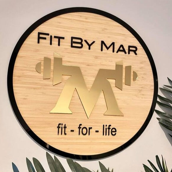 Fit by Mar bamboo sign with bold fitness logo and acrylic lettering