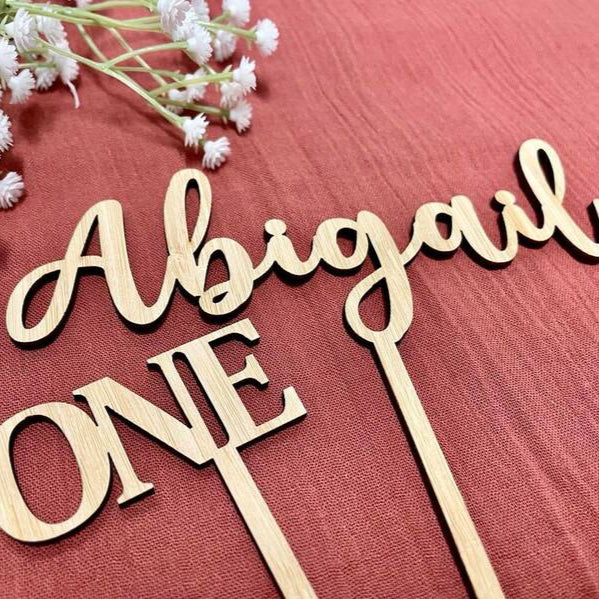 Abigail one bamboo first birthday cake topper custom name design