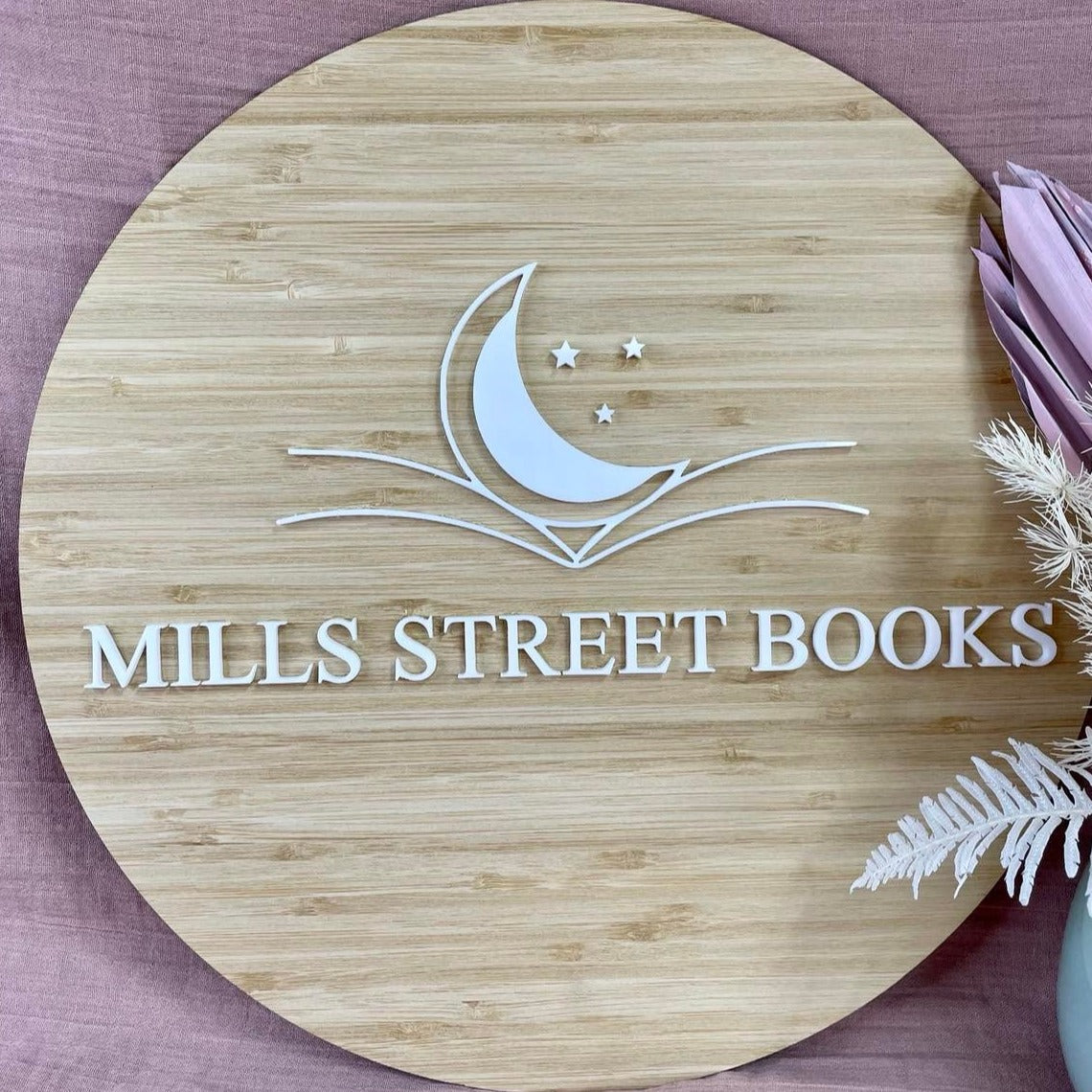 Mills Street Books bamboo sign with crescent moon and engraved design