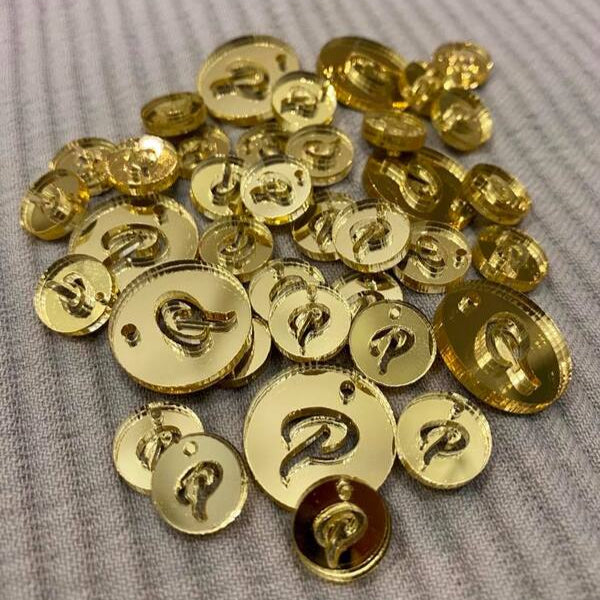 Gold acrylic product tags with engraved monogram for product branding