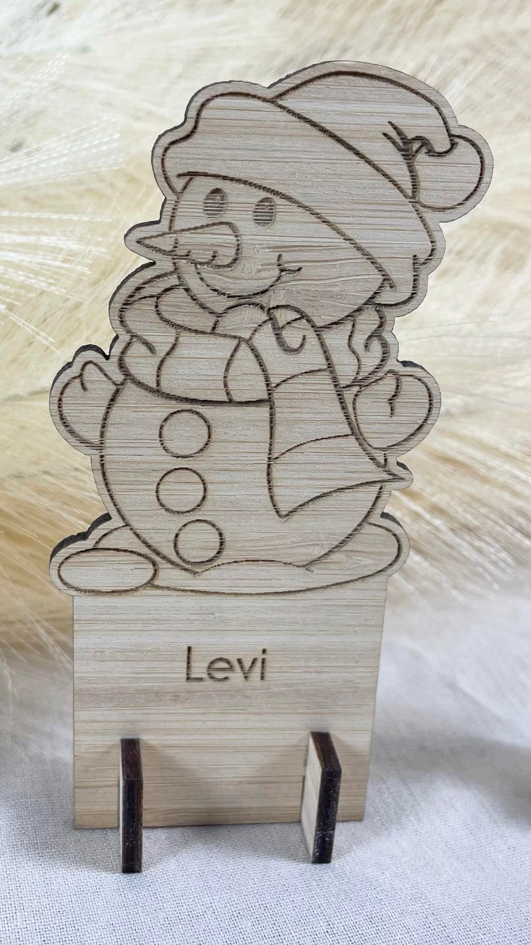 Engraved wooden Christmas place card with snowman design and custom guest name for table décor”