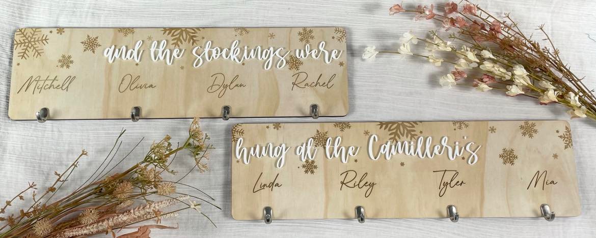 Wooden stocking hanger rack with family name hooks for displaying Christmas stockings