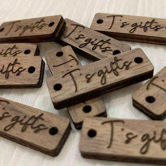Close up of engraved wooden rectangle tags used for craft and retail branding