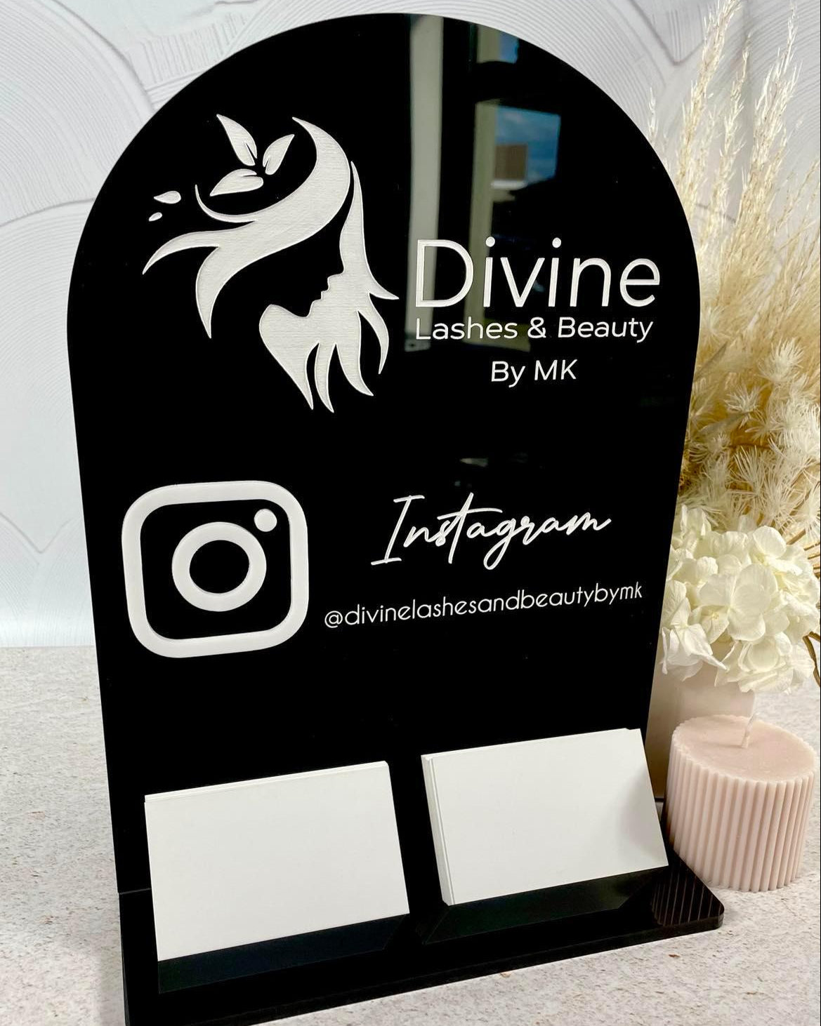 Black acrylic double card holder with Divine by Mone logo and Instagram icon