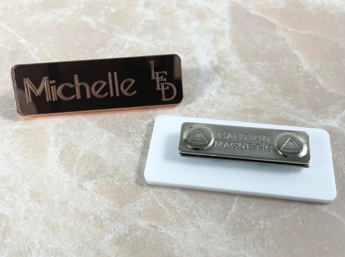 Close up of magnetic backing on a custom name badge