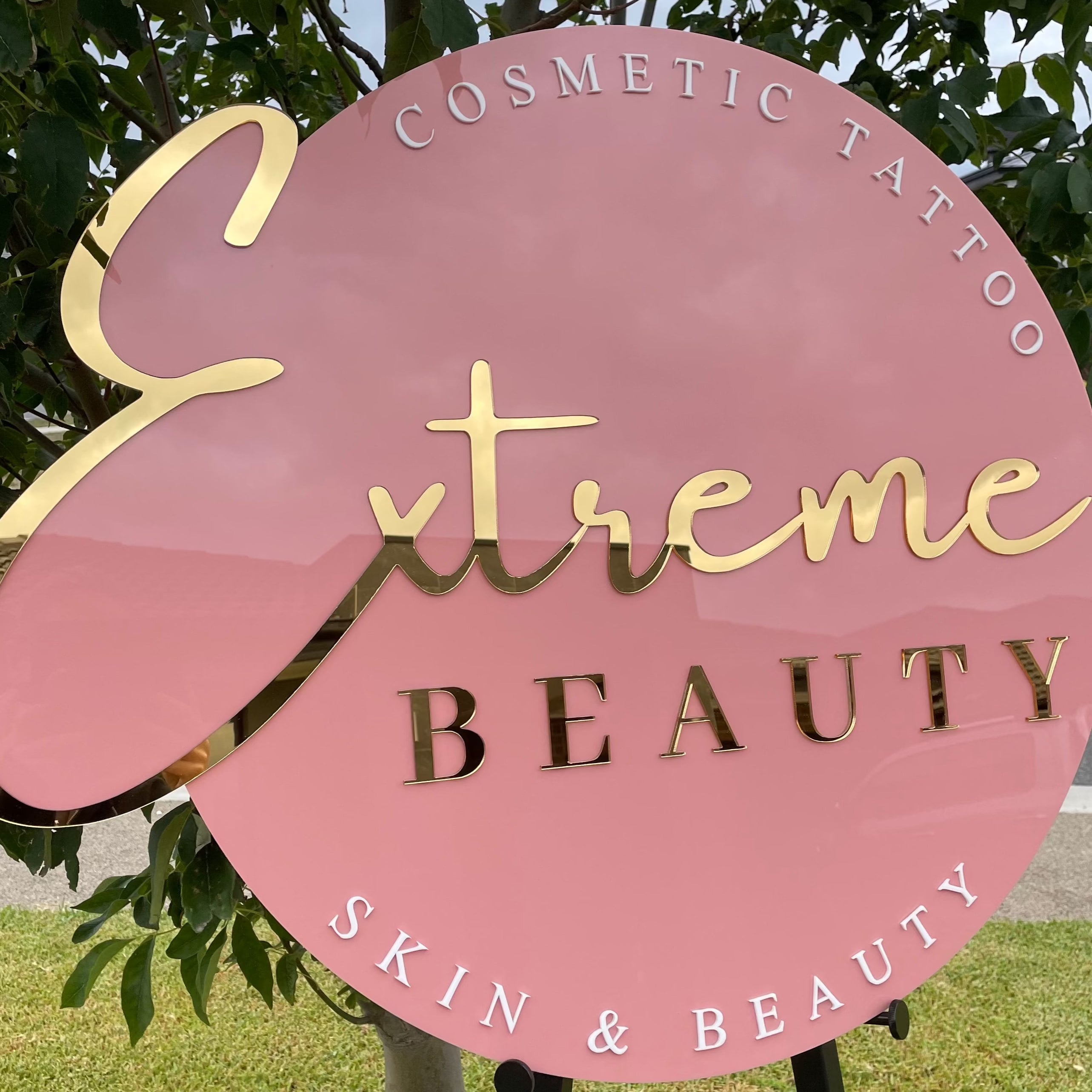 pink round beauty sign with layered acrylic. extreme beauty