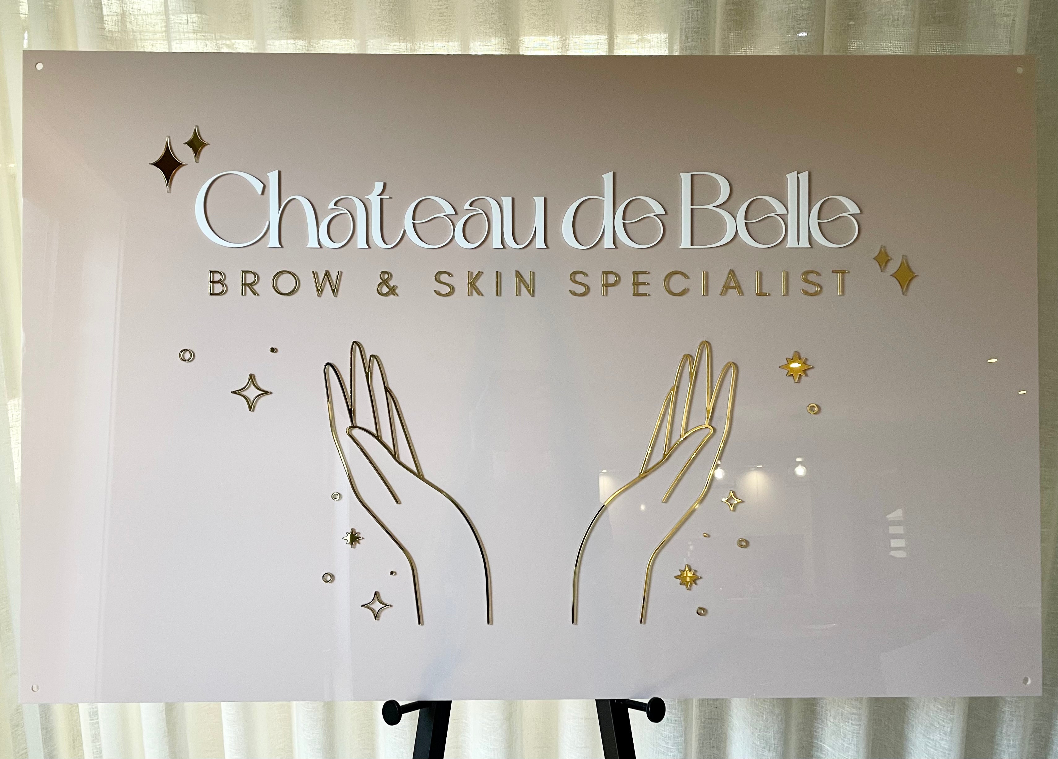 Illustrated brow and beauty sign for Chateau de Belle