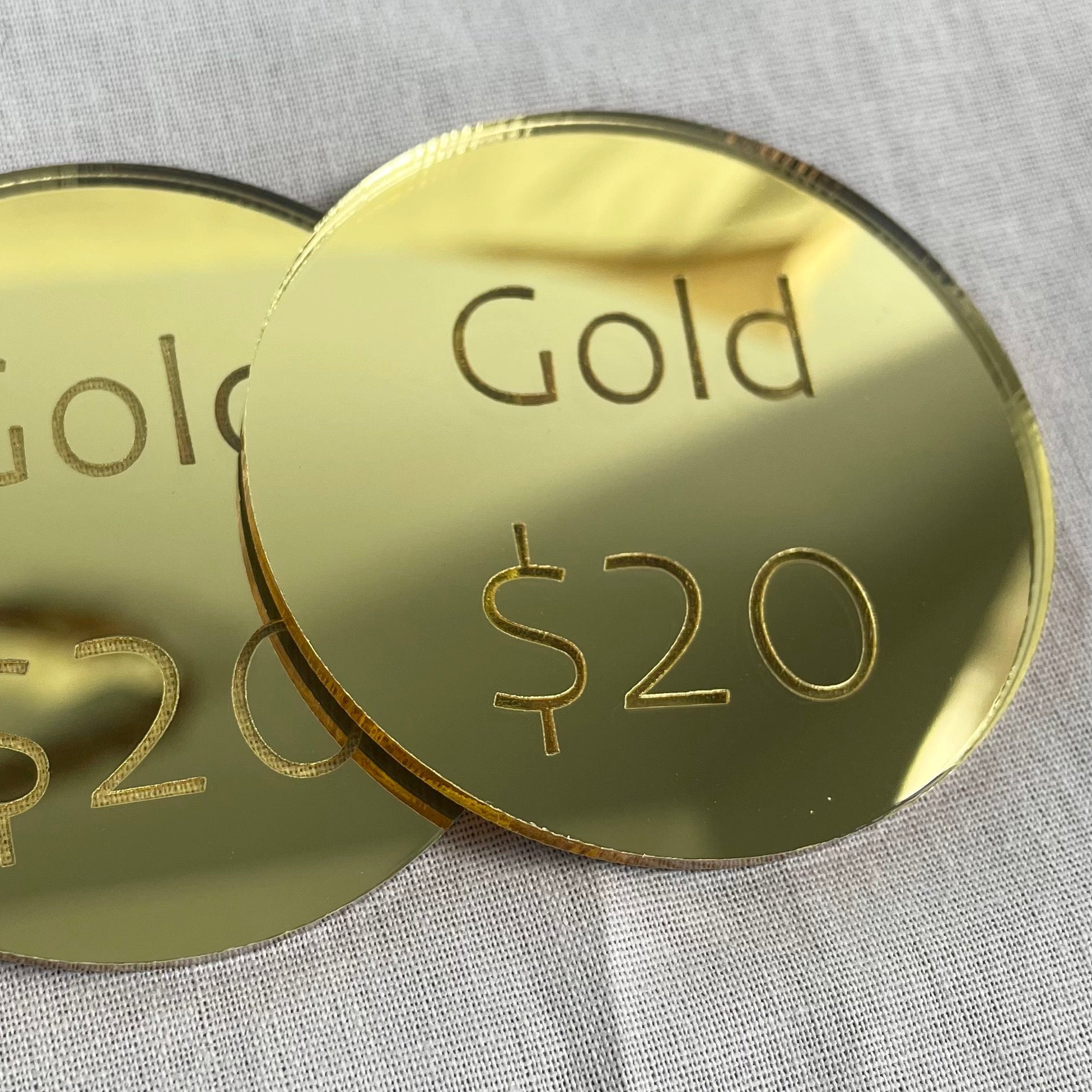 Gold mirror acrylic price discs engraved with Gold $20 text