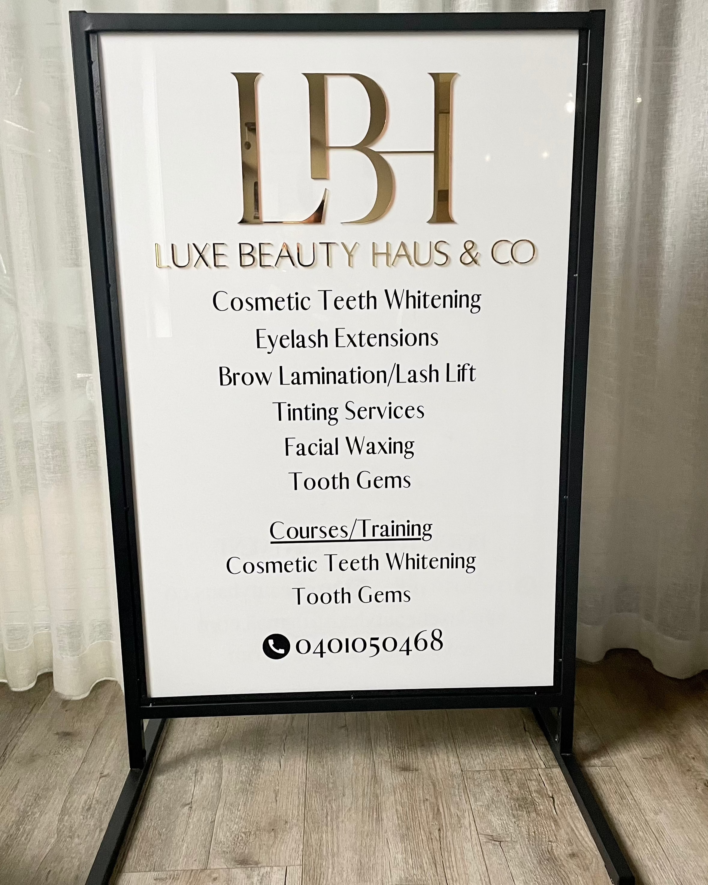 White and gold T frame advertising business