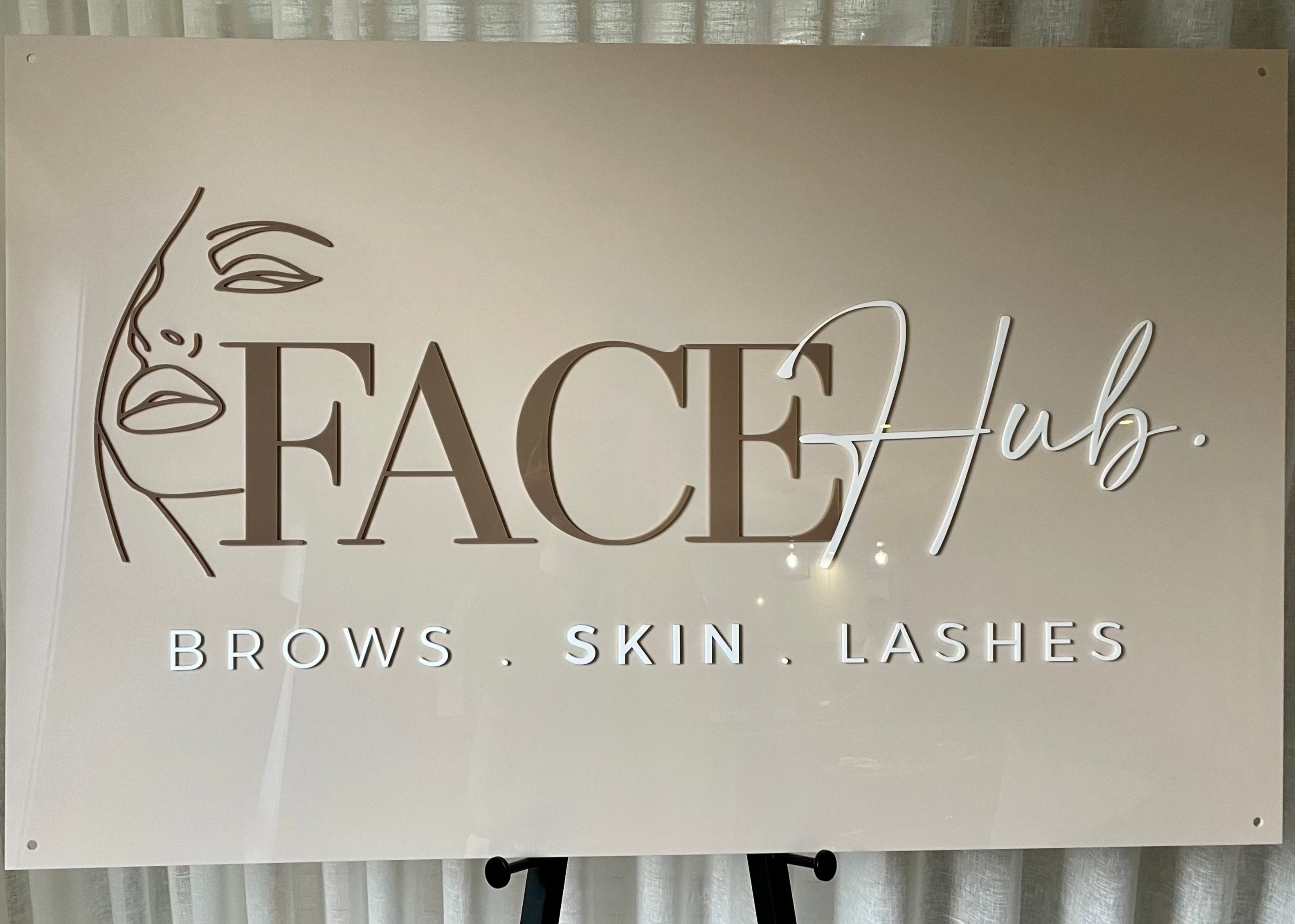 FACE Hub rectangular acrylic sign with cursive logo