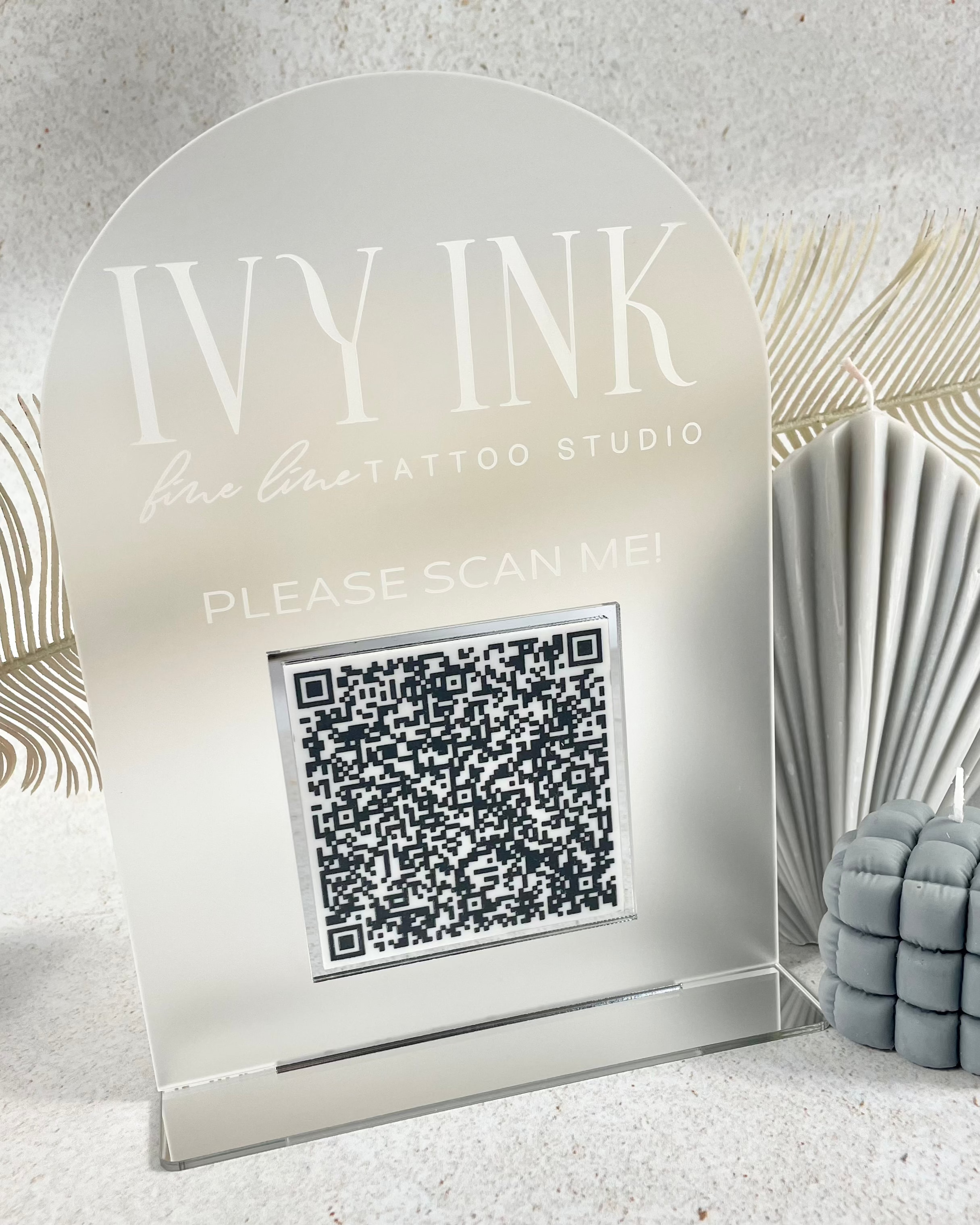 Modern QR code check-in stand with logo for tattoo studio