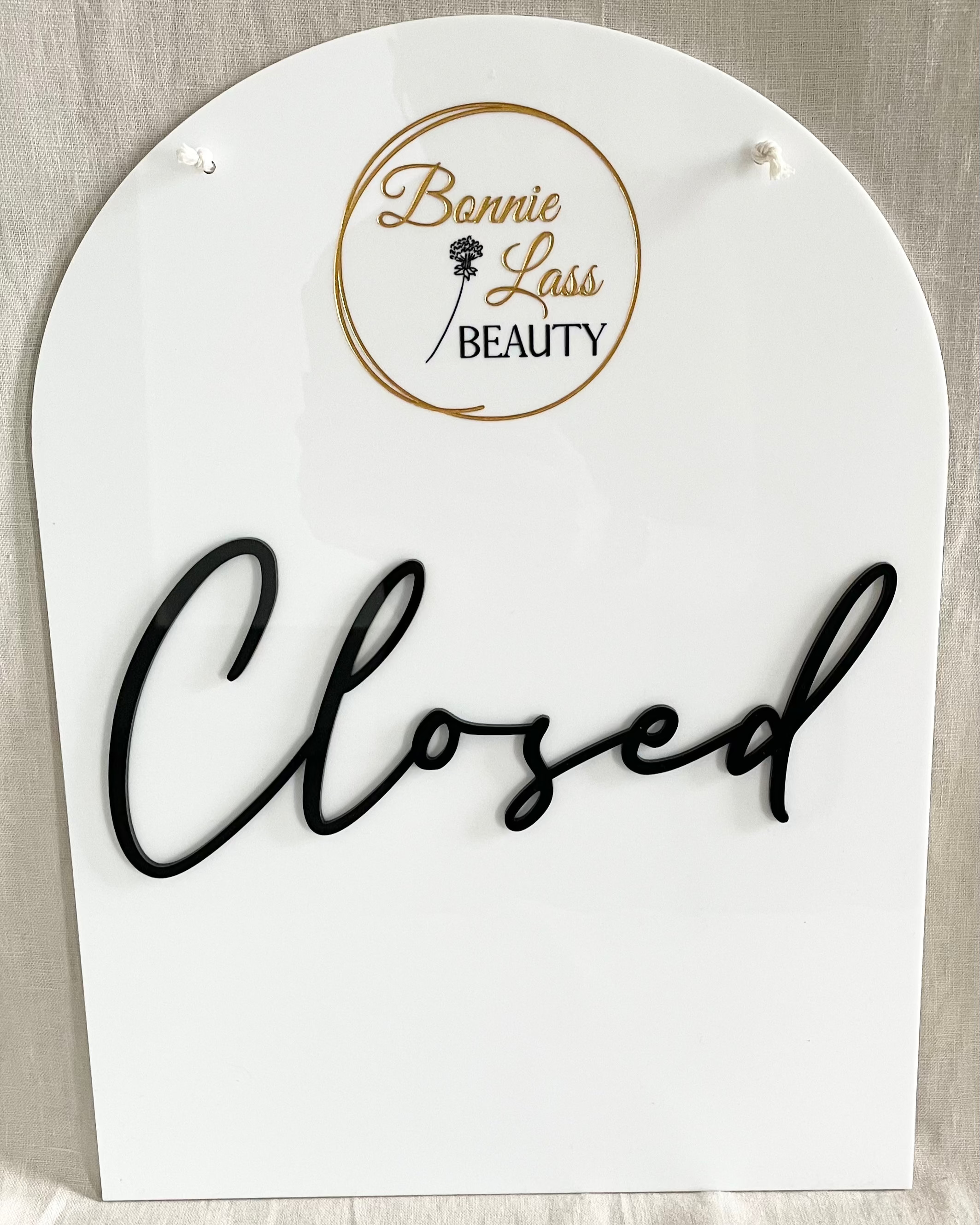 Closed sign in white acrylic with black script – beauty salon door sign