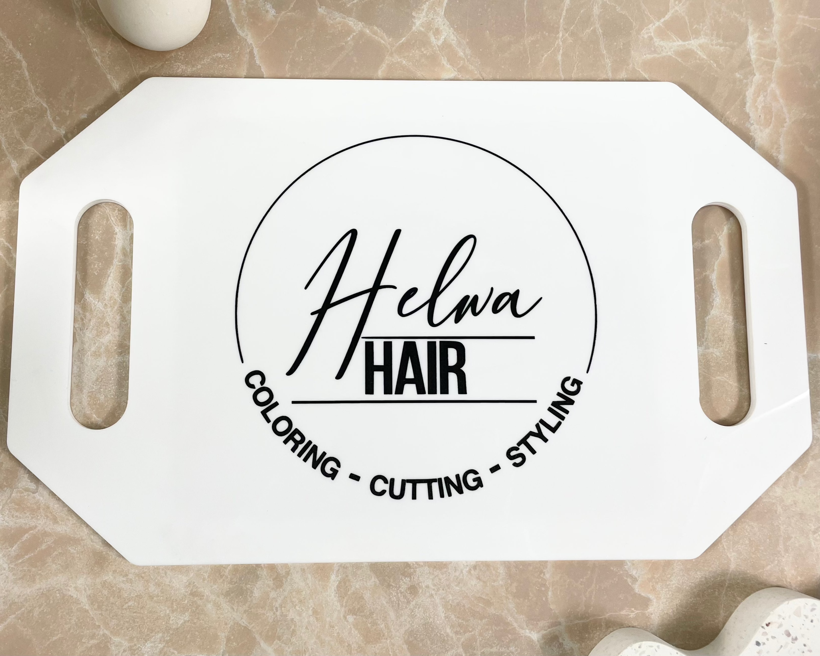 Helnia Hair custom salon mirror with cutting and styling logo