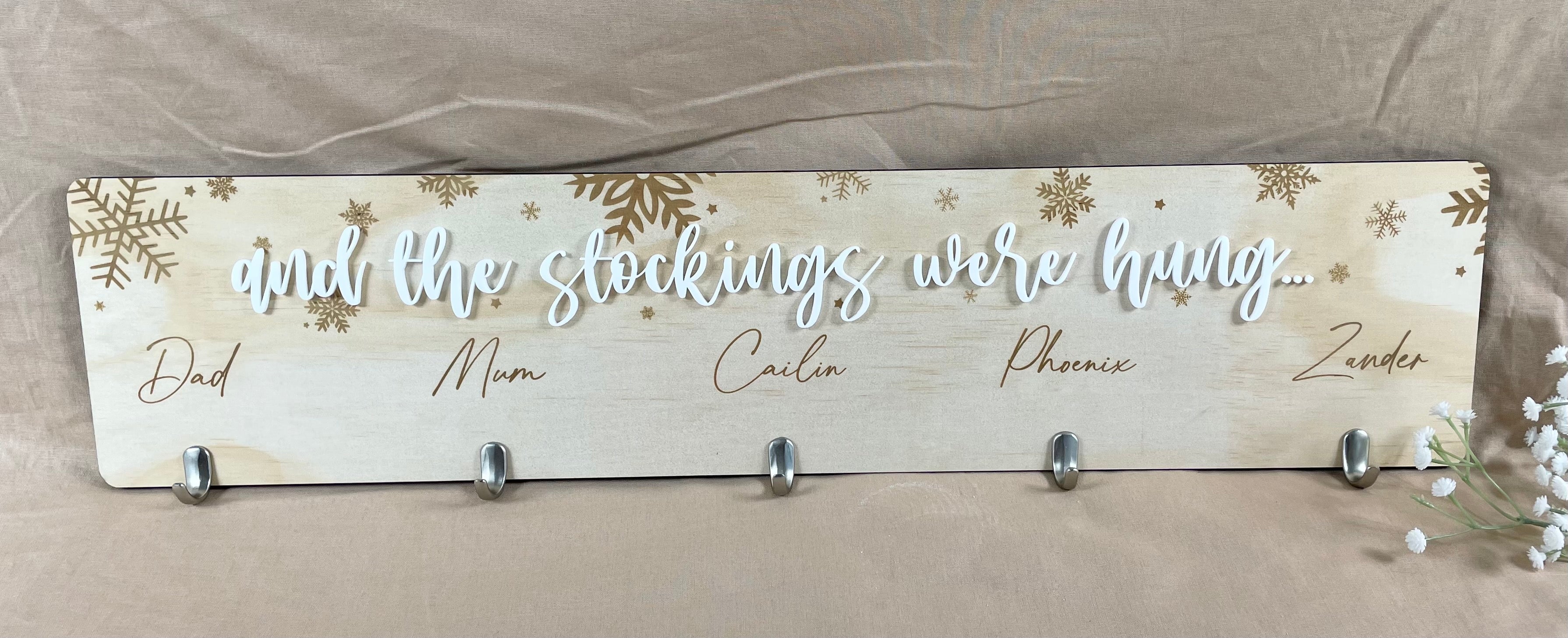 Custom Christmas stocking hanger board with engraved names and hooks for family stockings