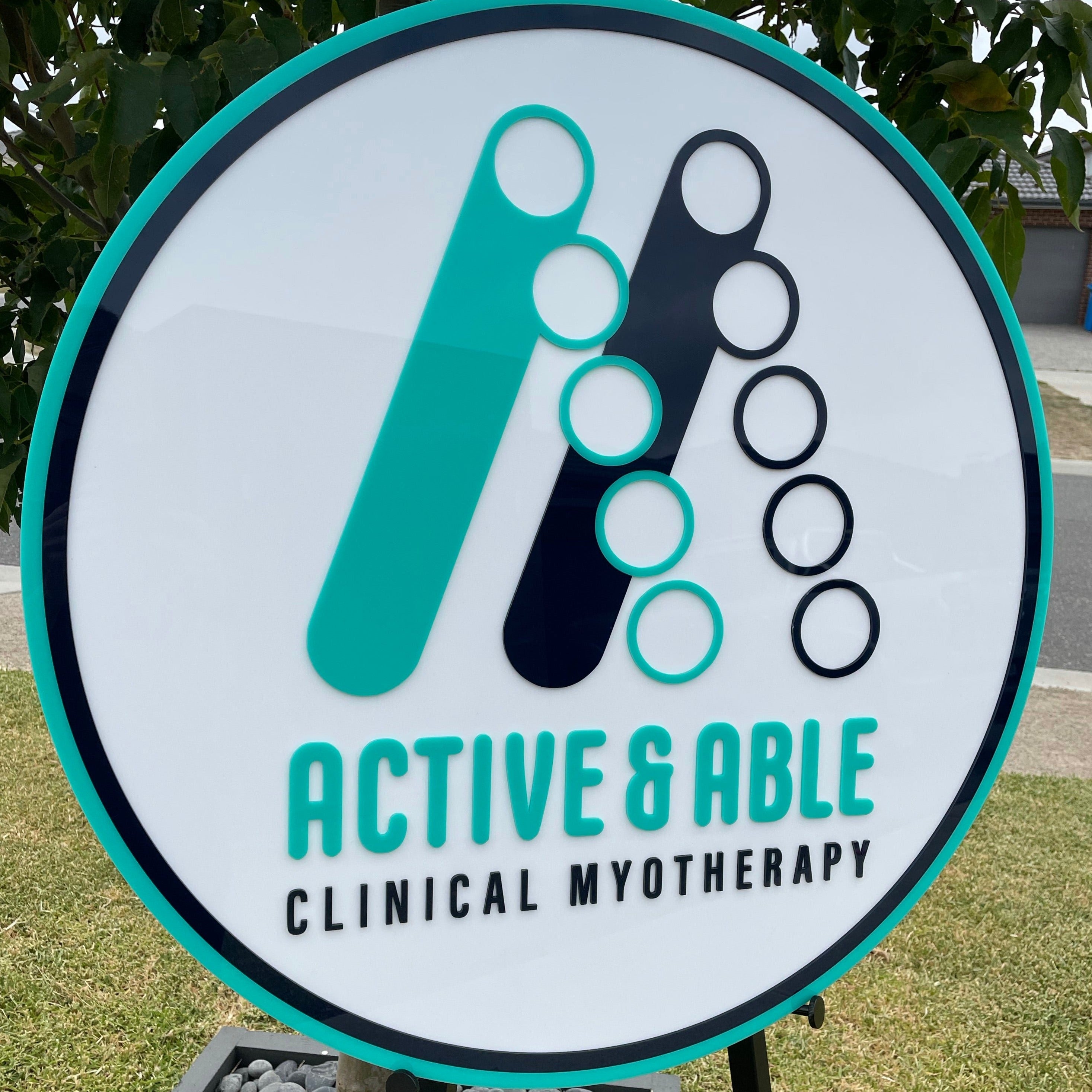 round aqua and teal acrylic physio sign. active and able