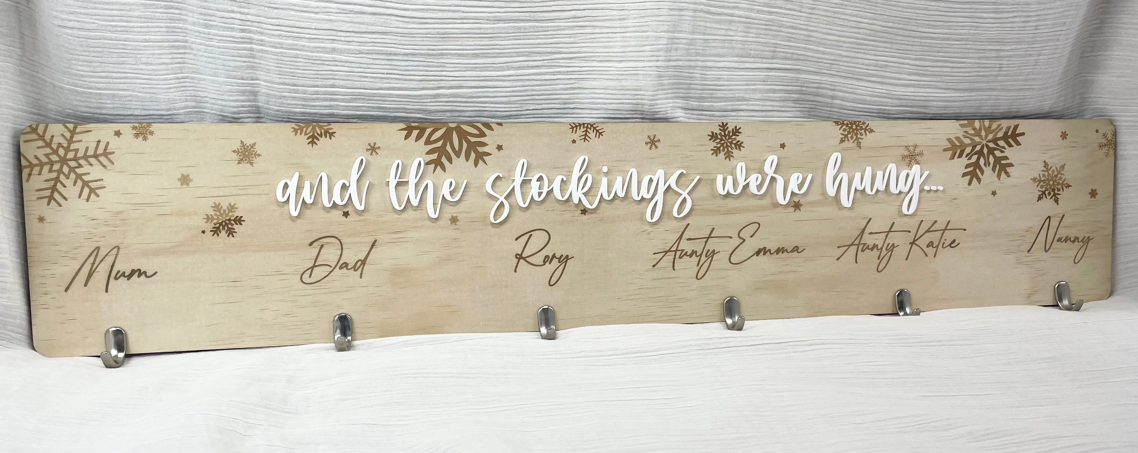 Personalised stocking hanger with family names and engraved timber hooks for Christmas décor