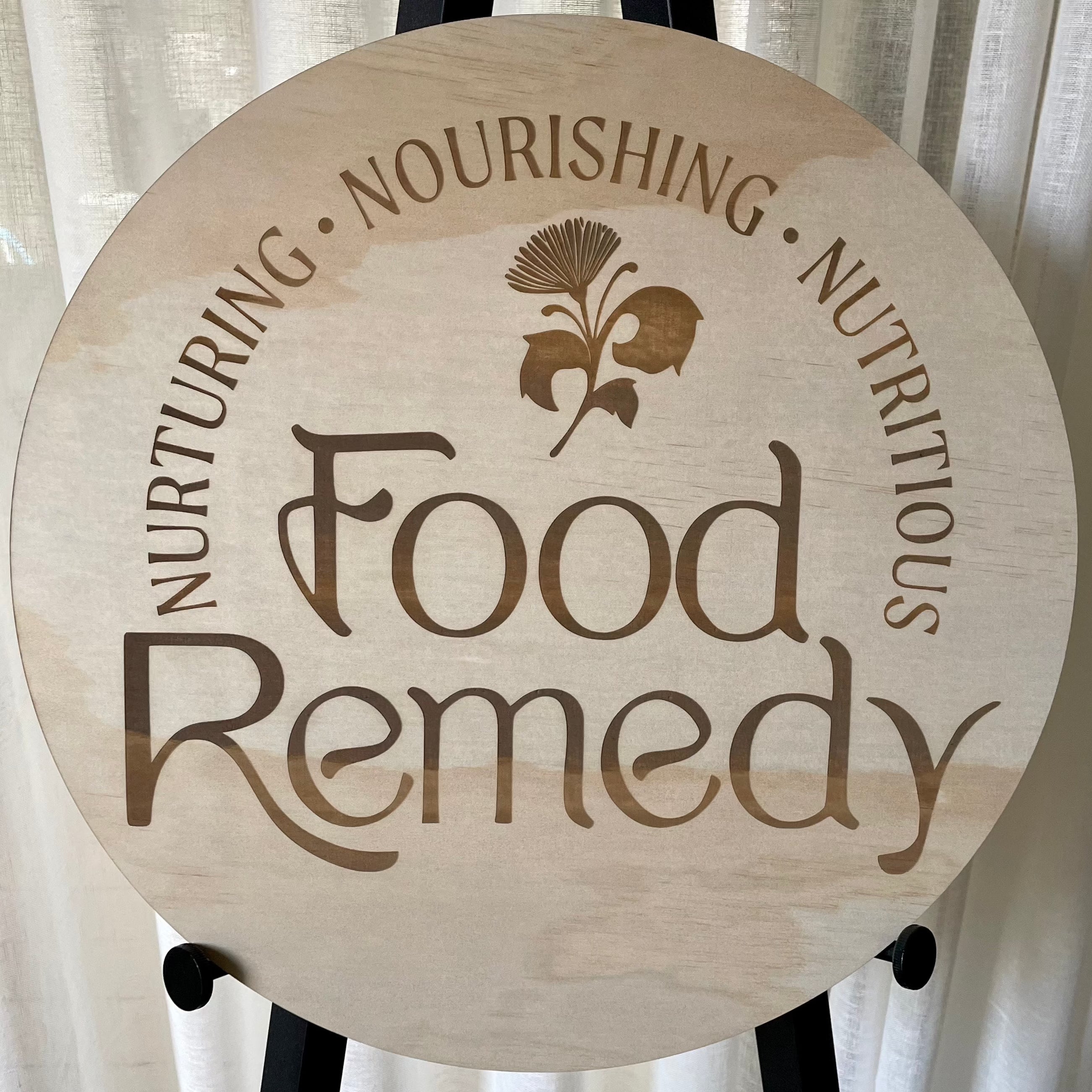 Food Remedy wooden business logo sign, engraved timber sign featuring bold branding and wellness-themed text for a health-based business.
