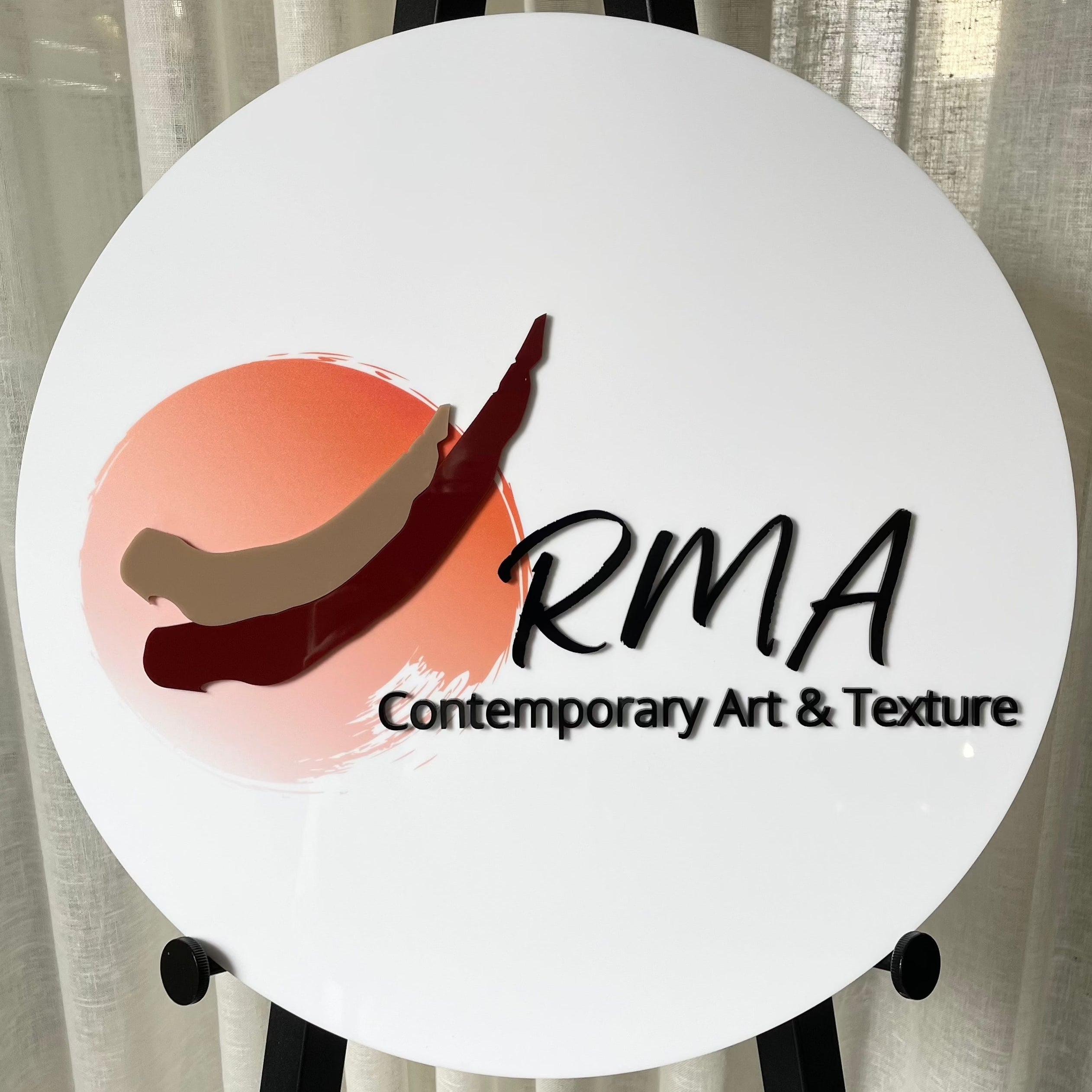 Curved red and brown printed signage for RMA Contemporary Art & Texture