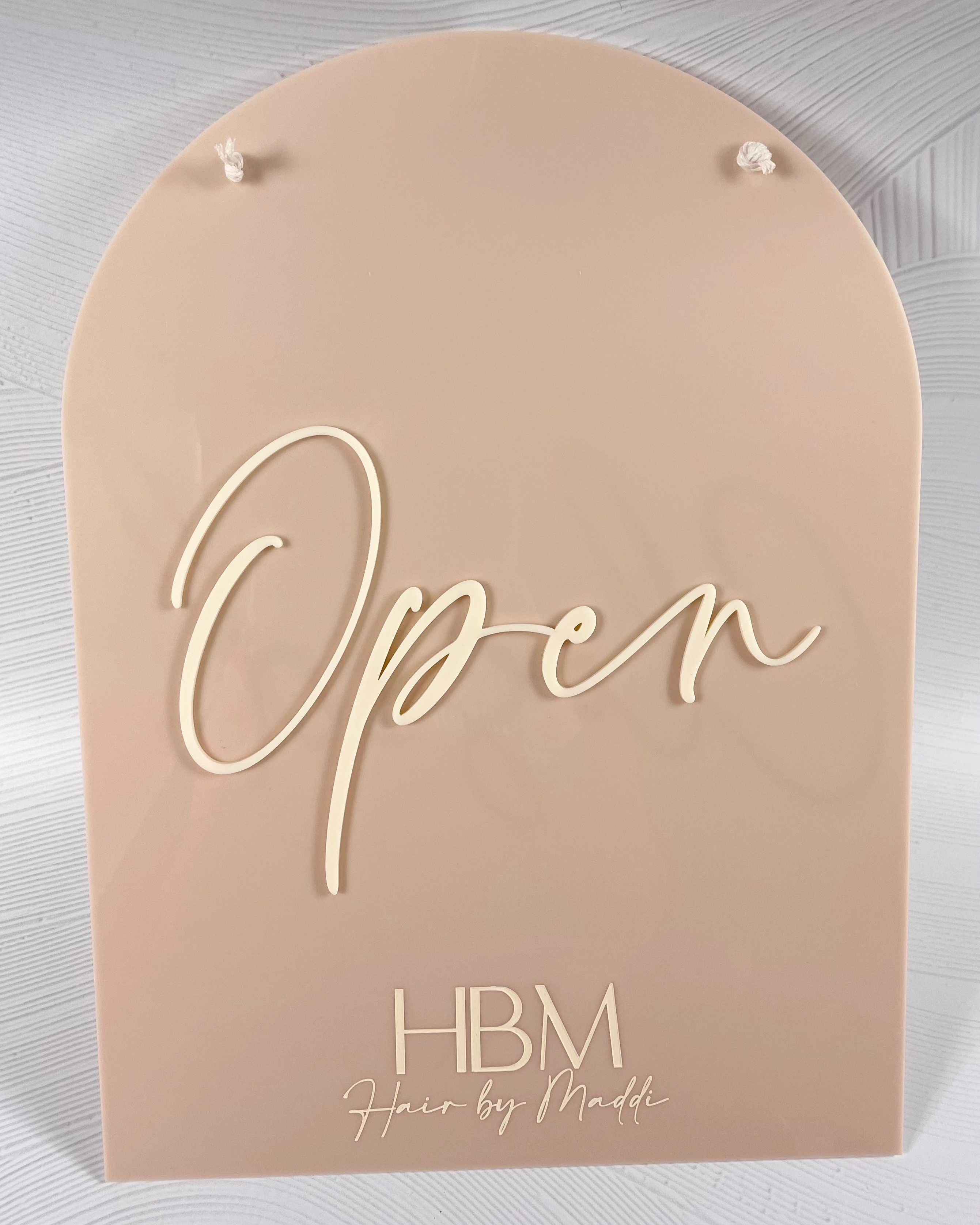 Open sign in soft beige acrylic with white script – arched door sign for salons