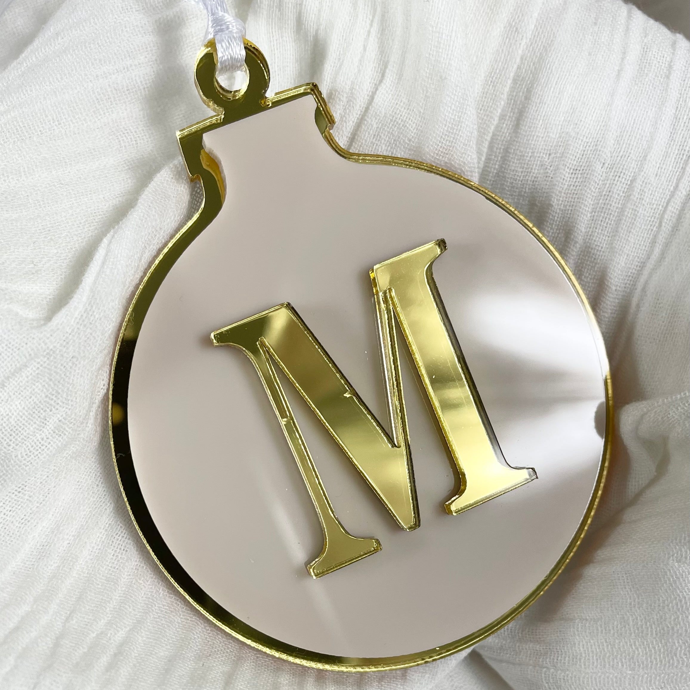 Elegant monogrammed Christmas bauble