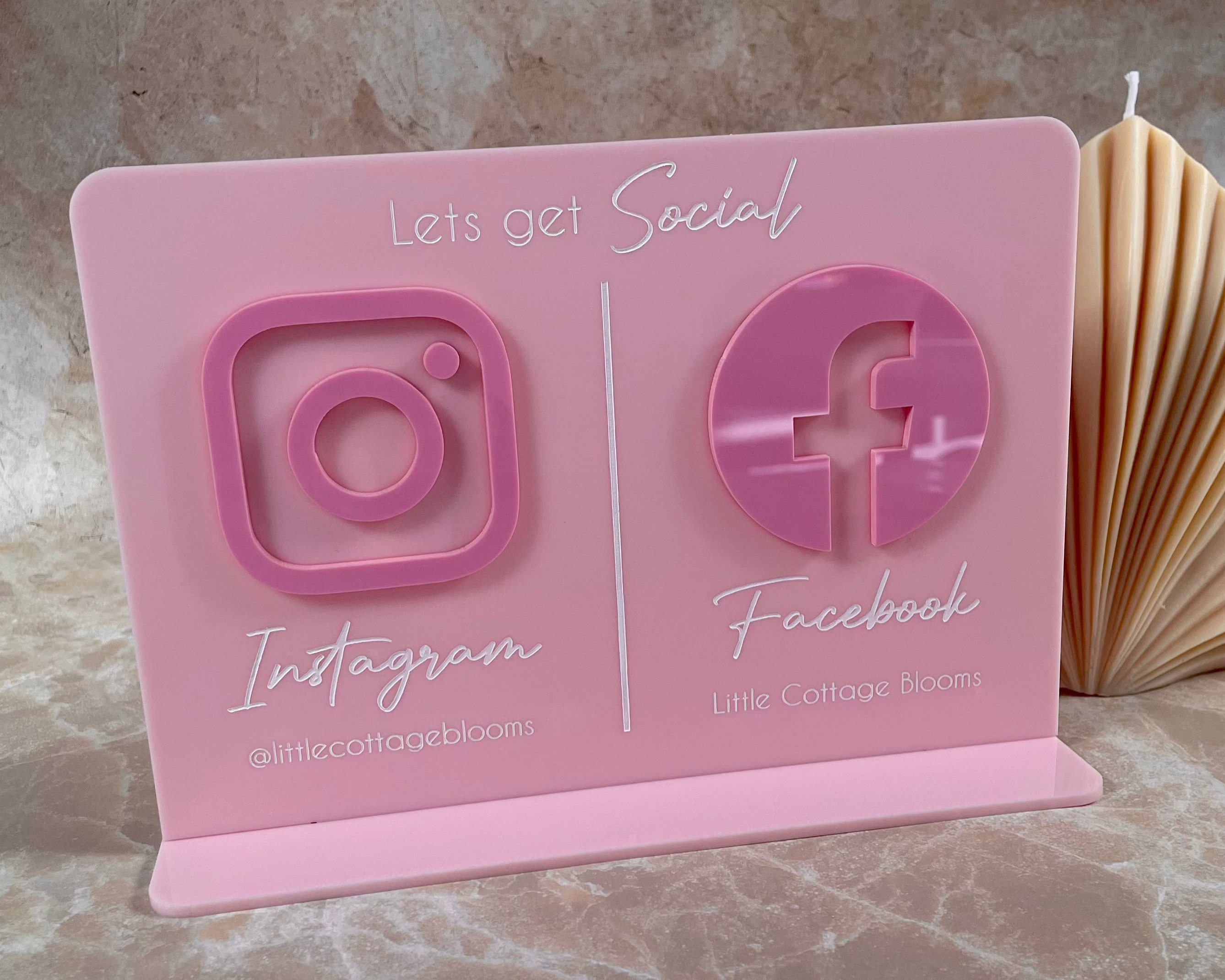 Pink acrylic double sided stand with UV printed Instagram and Facebook icons – custom social media signage for small business counters