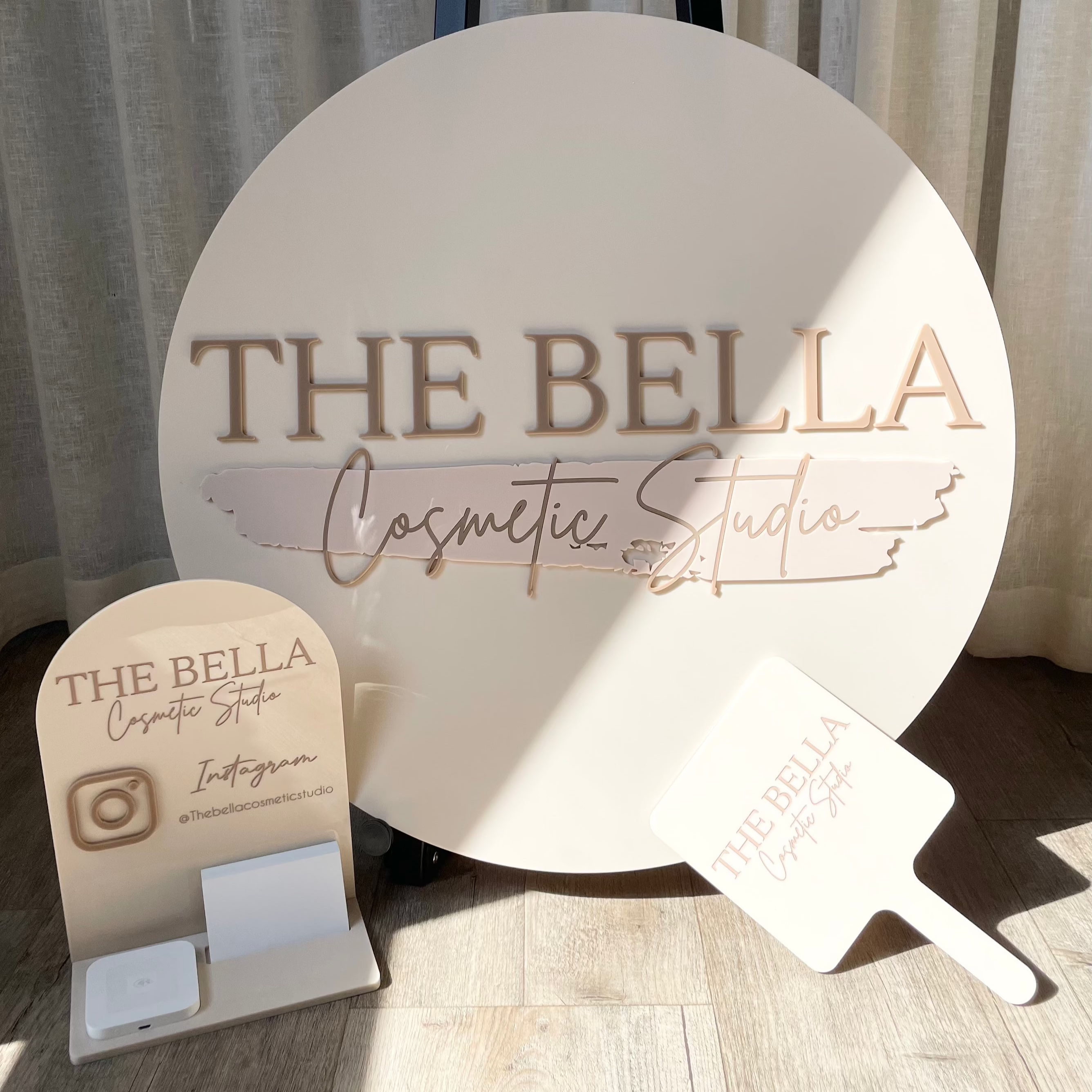 The Bella Cosmetic Boutique round sign set with card display and mirror