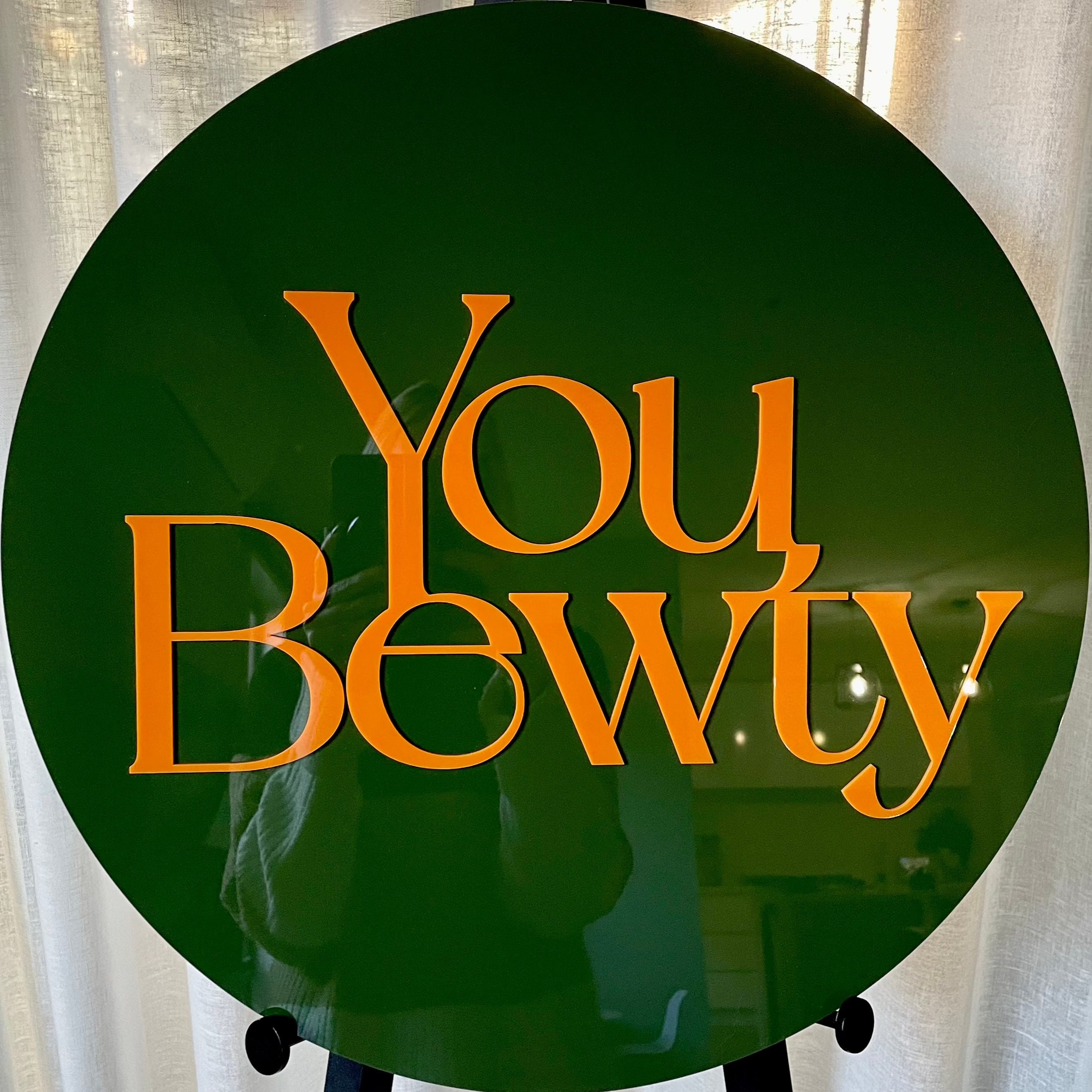 green round 3d acrylic sign with orange text. you bewty