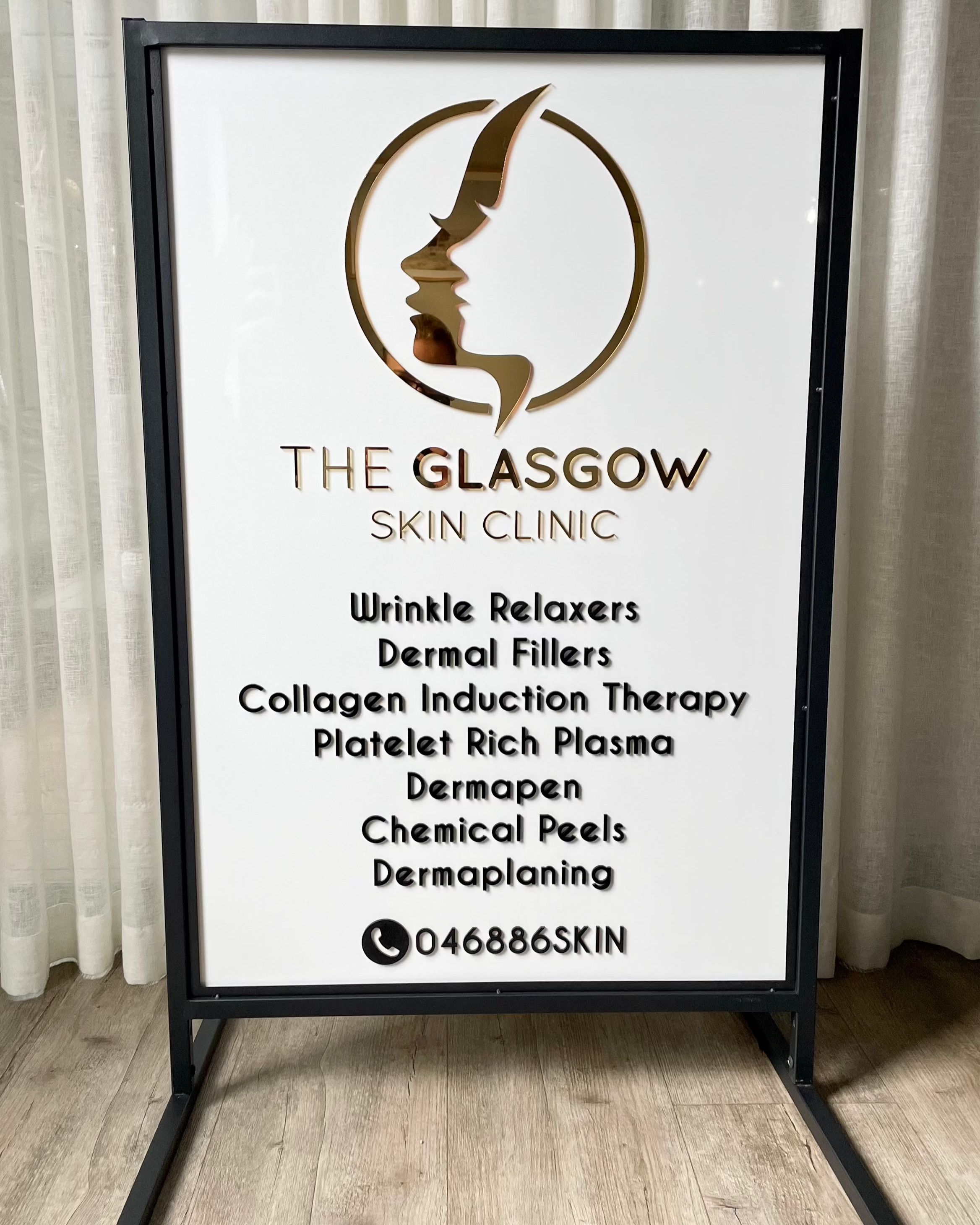 White T frame advertising board for cosmetic procedures