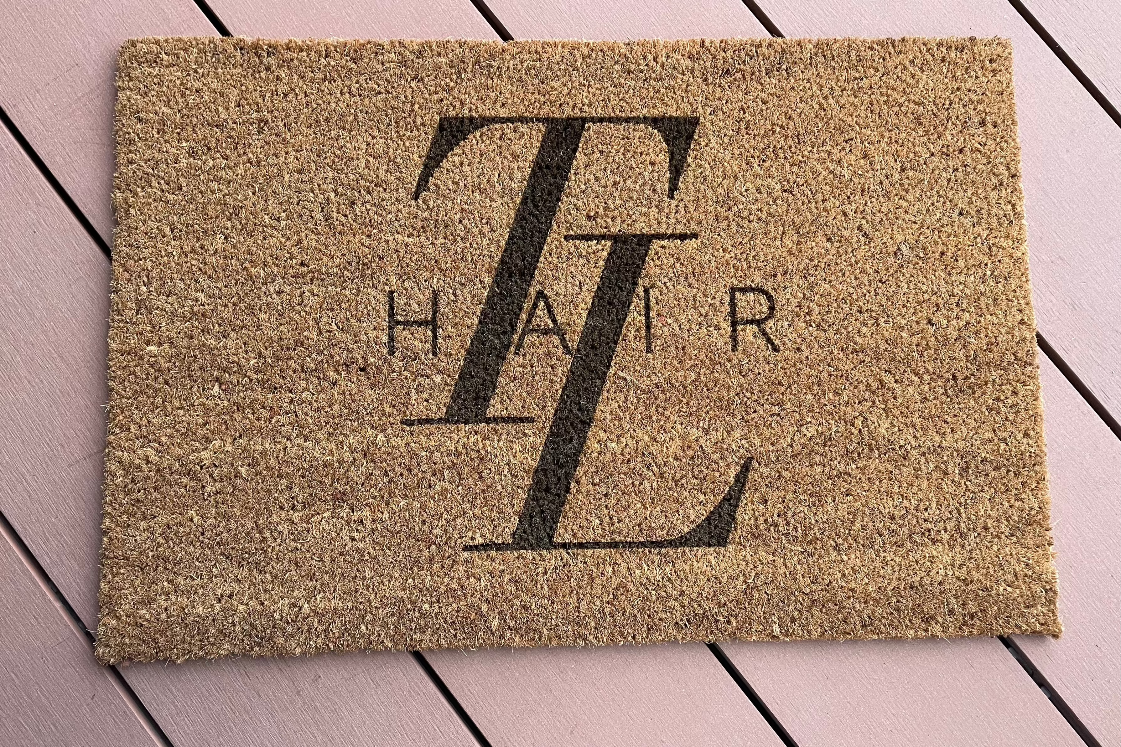 Custom hair salon logo printed on a coir door mat