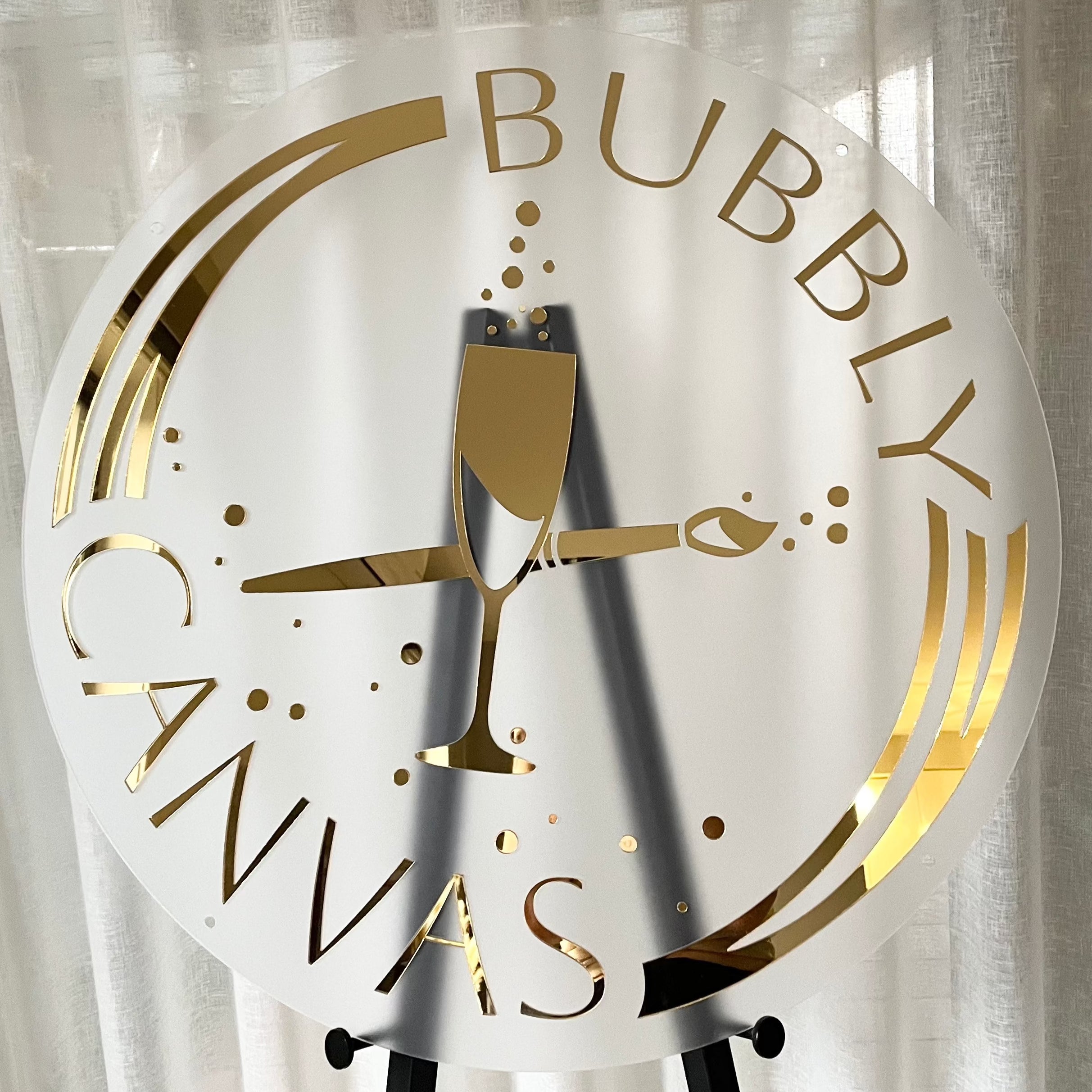 Frosted acrylic business sign with gold mirror text. Bubbly canvas