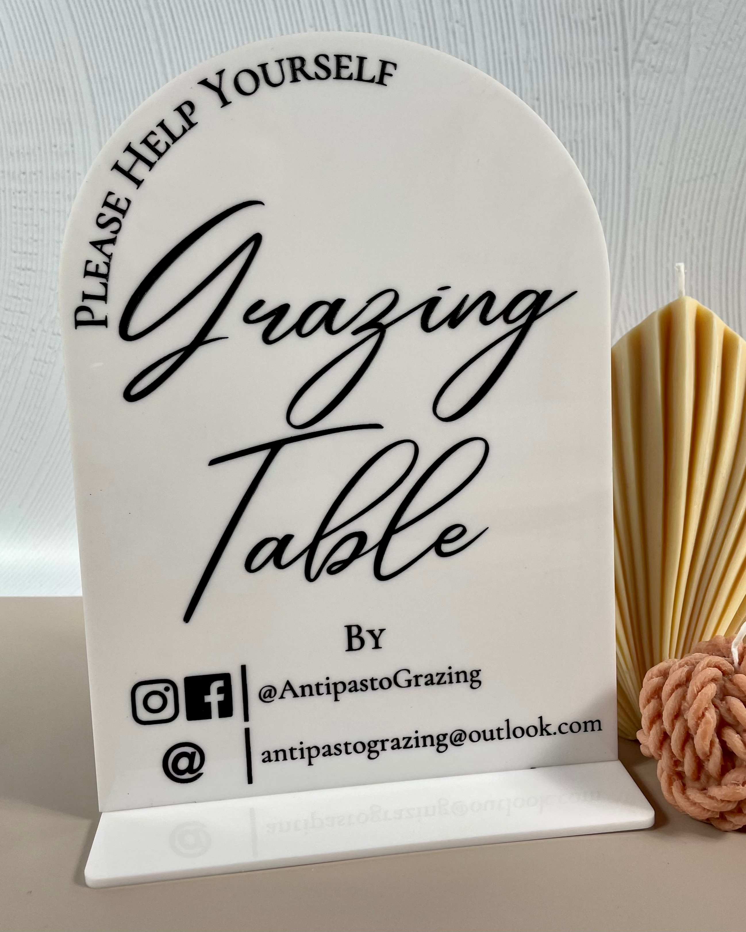 Beige grazing table stand with social icons
