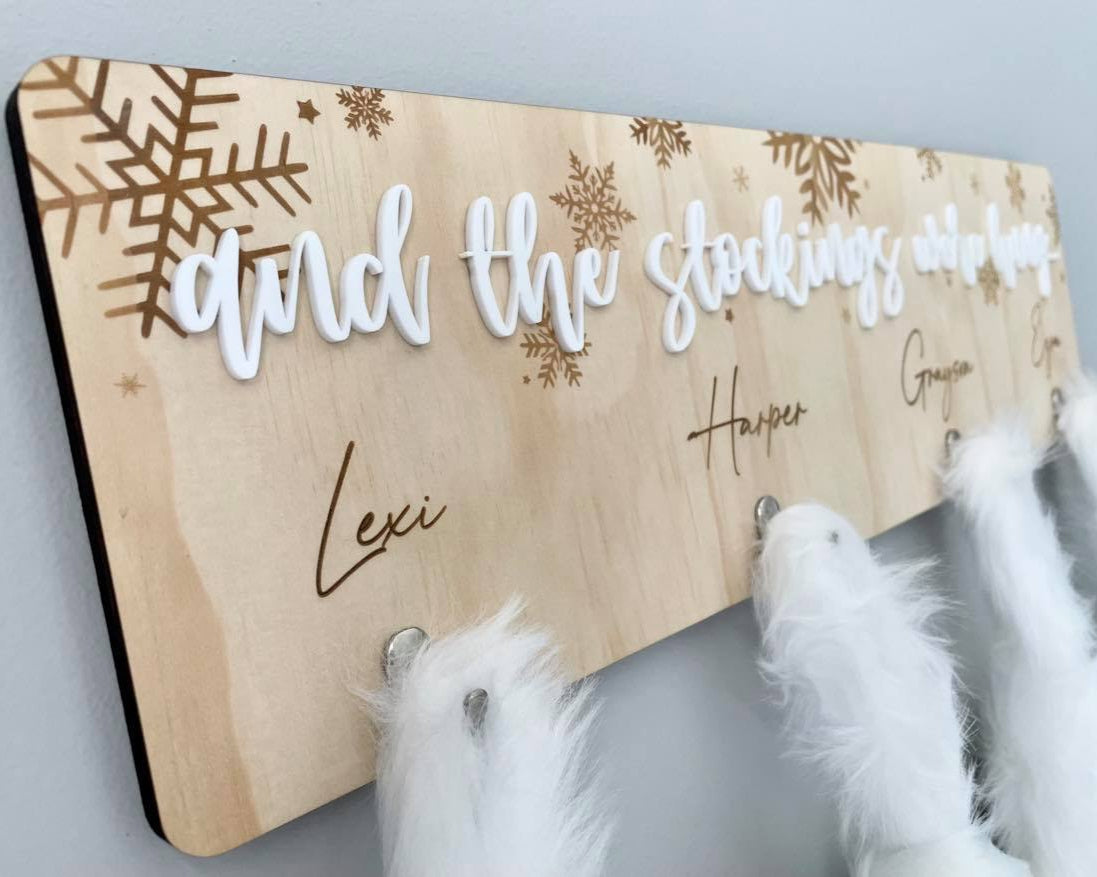 Wooden Christmas stocking hanger personalised with family names and snowflake design