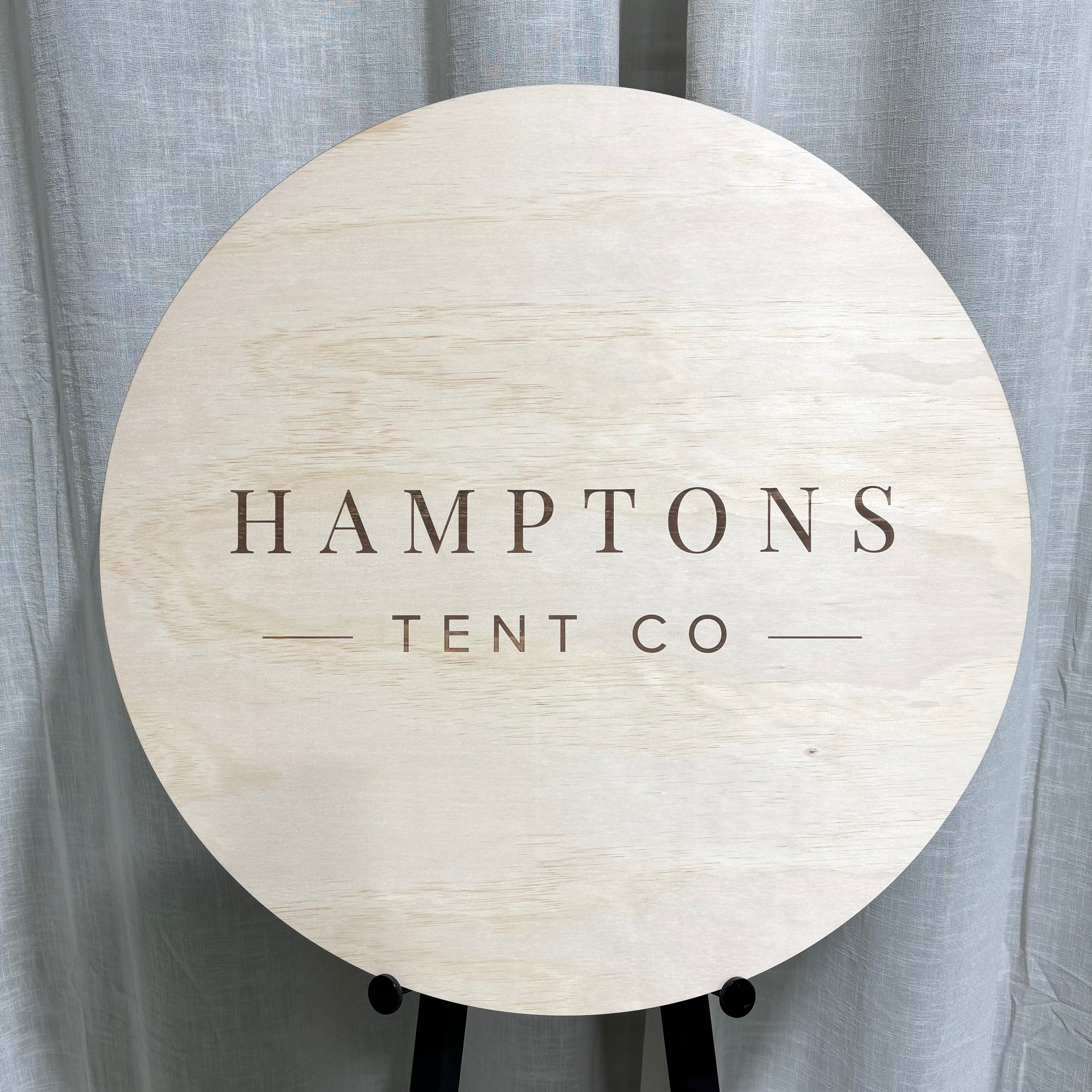 round engraved timber business sign with logo
