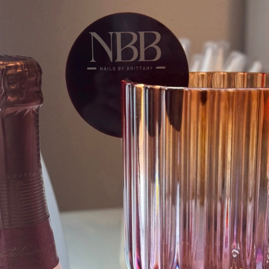 Personalised acrylic drink tags with business logo, custom cocktail markers for salons and events, branded glass tags for client drinks, reusable event signage tags, NBB Nails by Brittany drink tag branding for premium presentation
