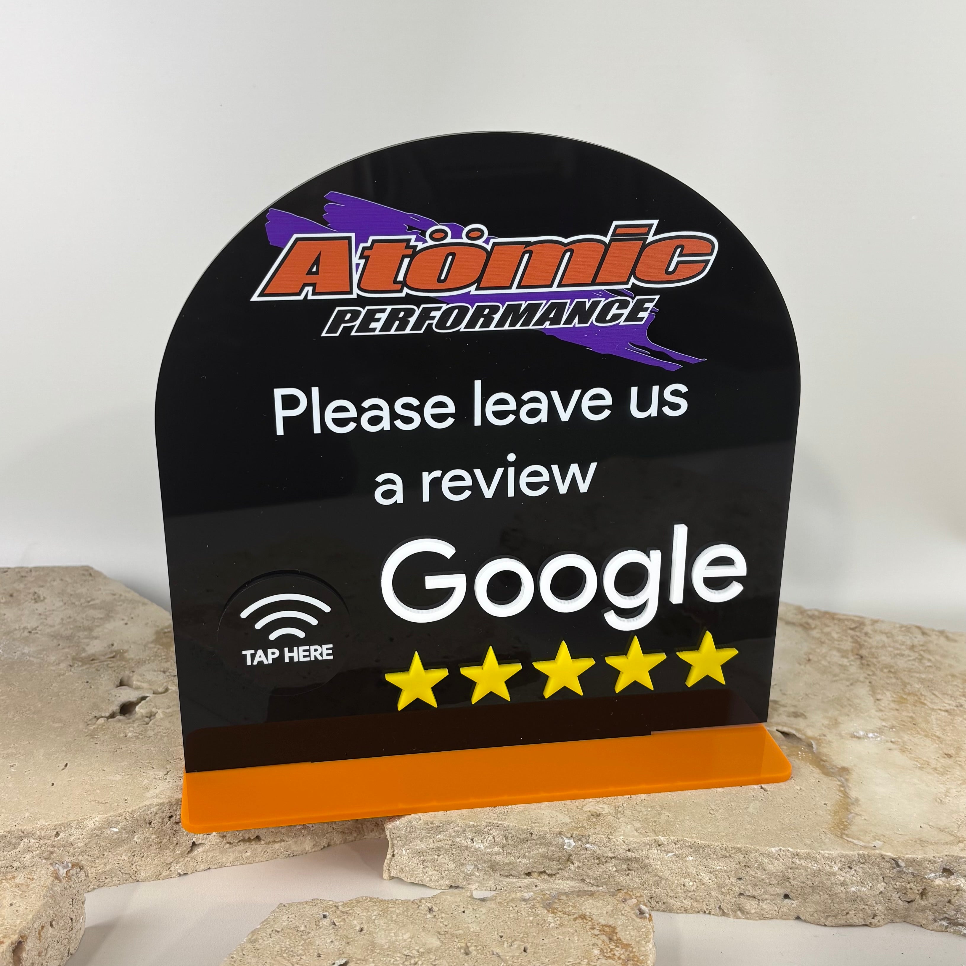 Custom NFC Google review stand with tap-to-review symbol and five star rating display, black acrylic countertop sign designed for businesses to collect Google reviews instantly with a simple phone tap.