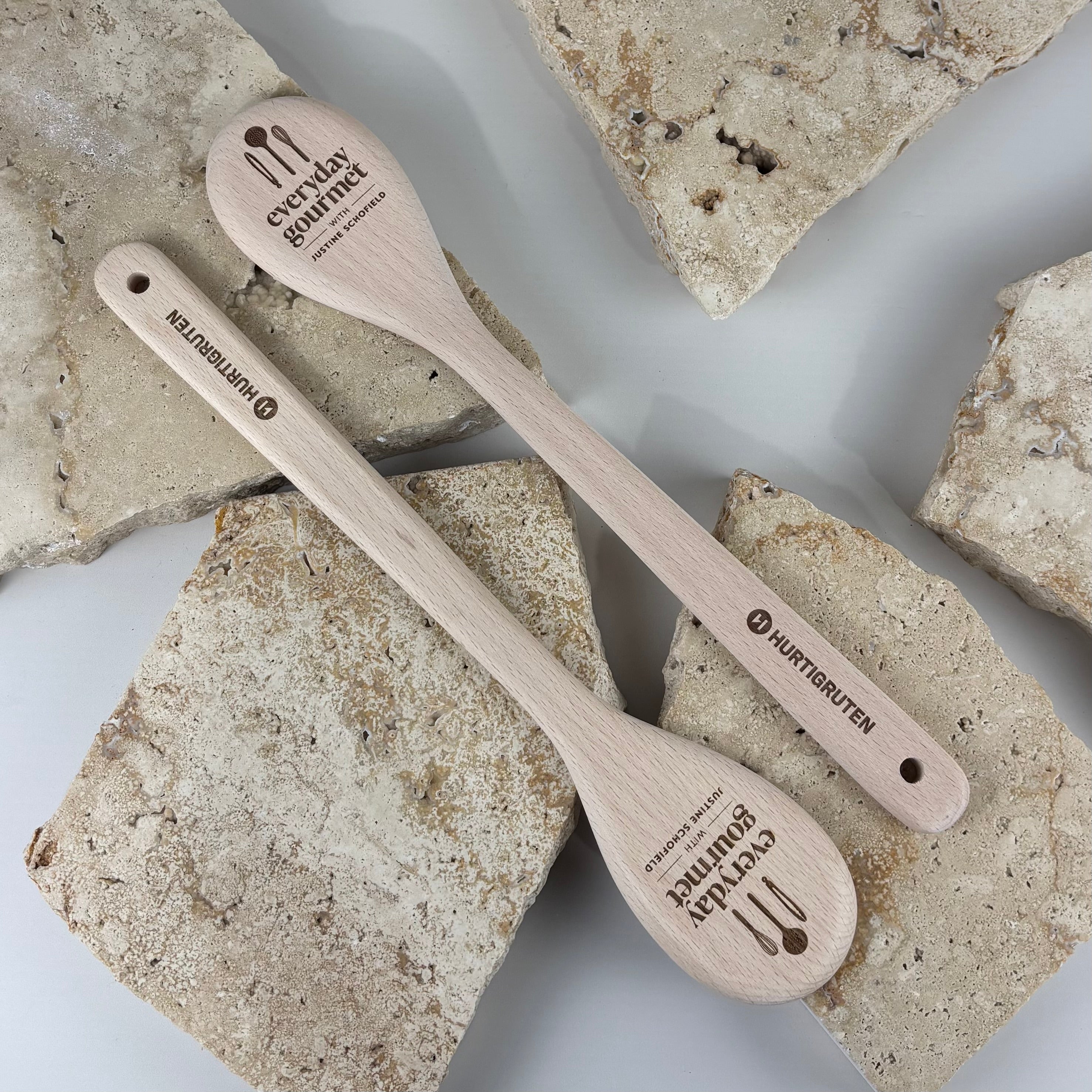 Custom engraved wooden cooking spoon personalised with business logo, promotional branding or corporate gift, laser engraved beech wood kitchen utensil for restaurants, cafés, food businesses, cooking schools and event giveaways.