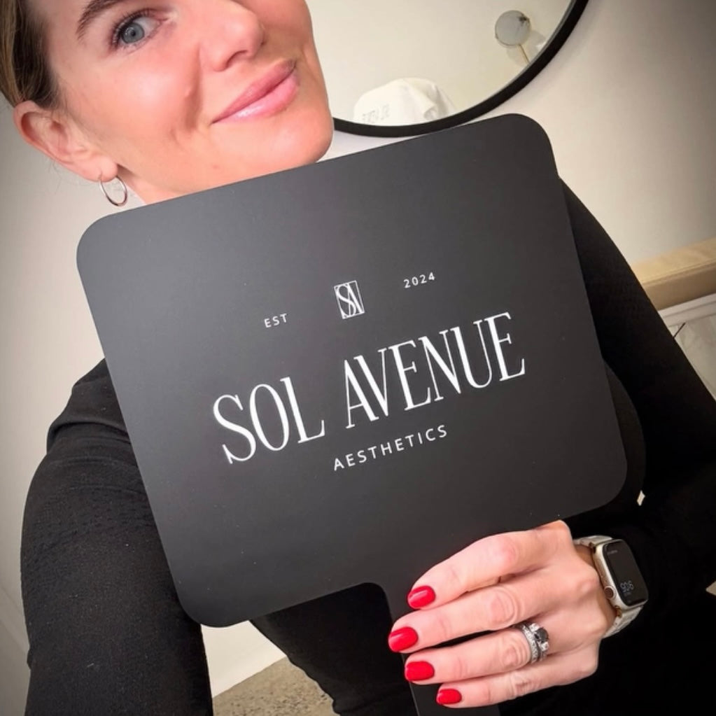 Custom black acrylic handheld mirror with white logo, branded salon mirror for client reveals and treatment photos, personalised beauty mirror Australia