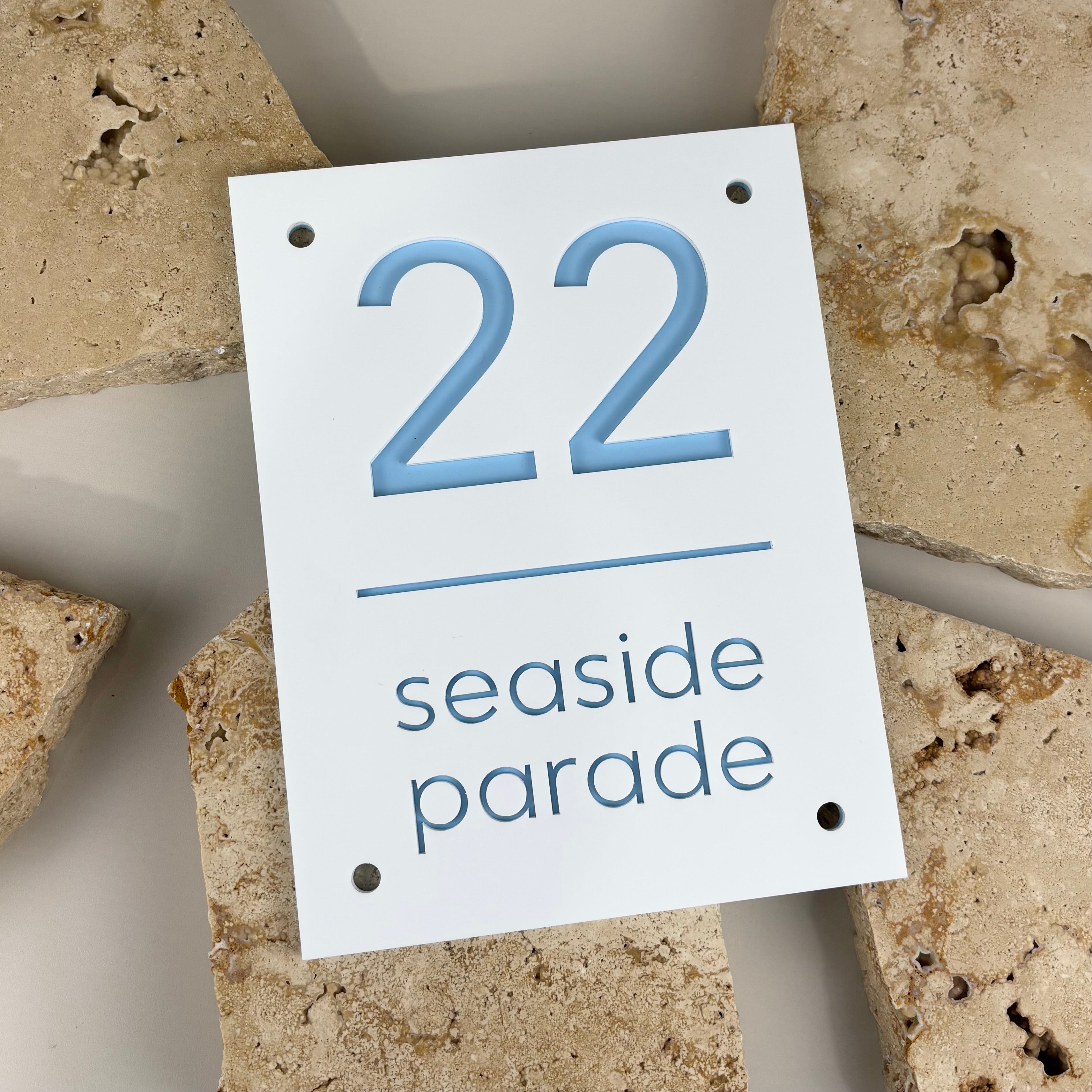 Modern acrylic house number sign with cut-out numbers and street name, custom address plaque in white with blue detail, personalised outdoor house signage, durable contemporary address sign Australia