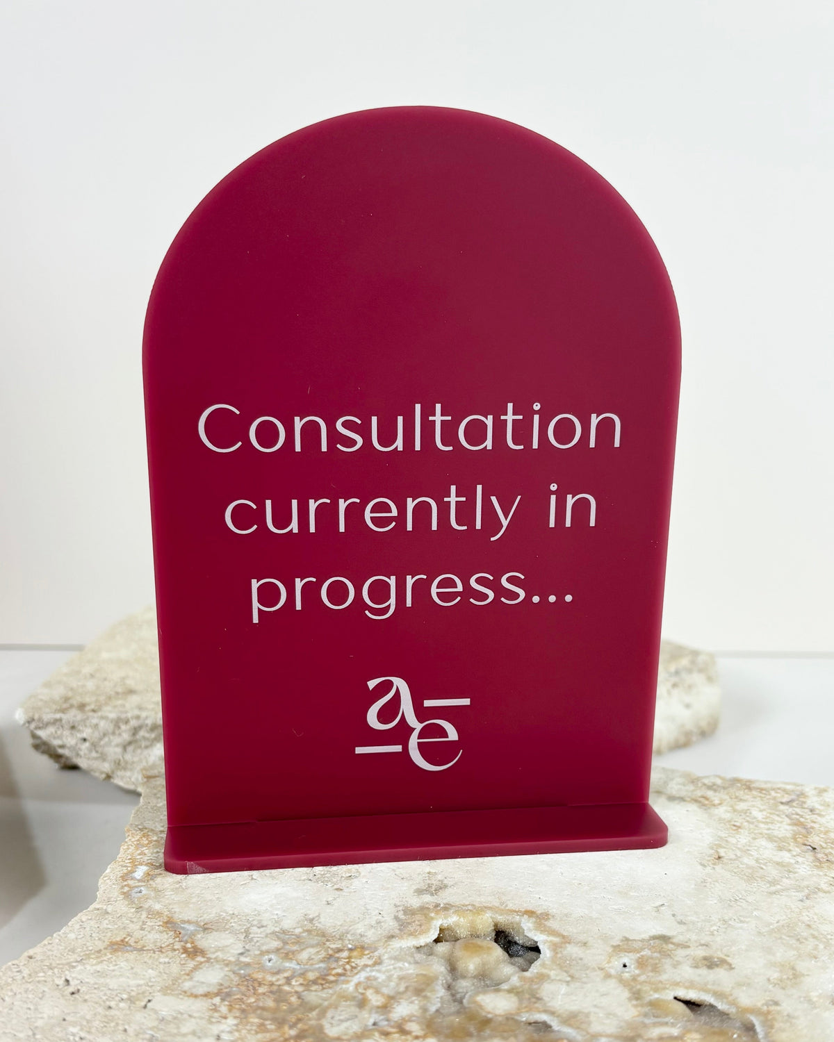 Deep red acrylic mini sign for private consultation notice