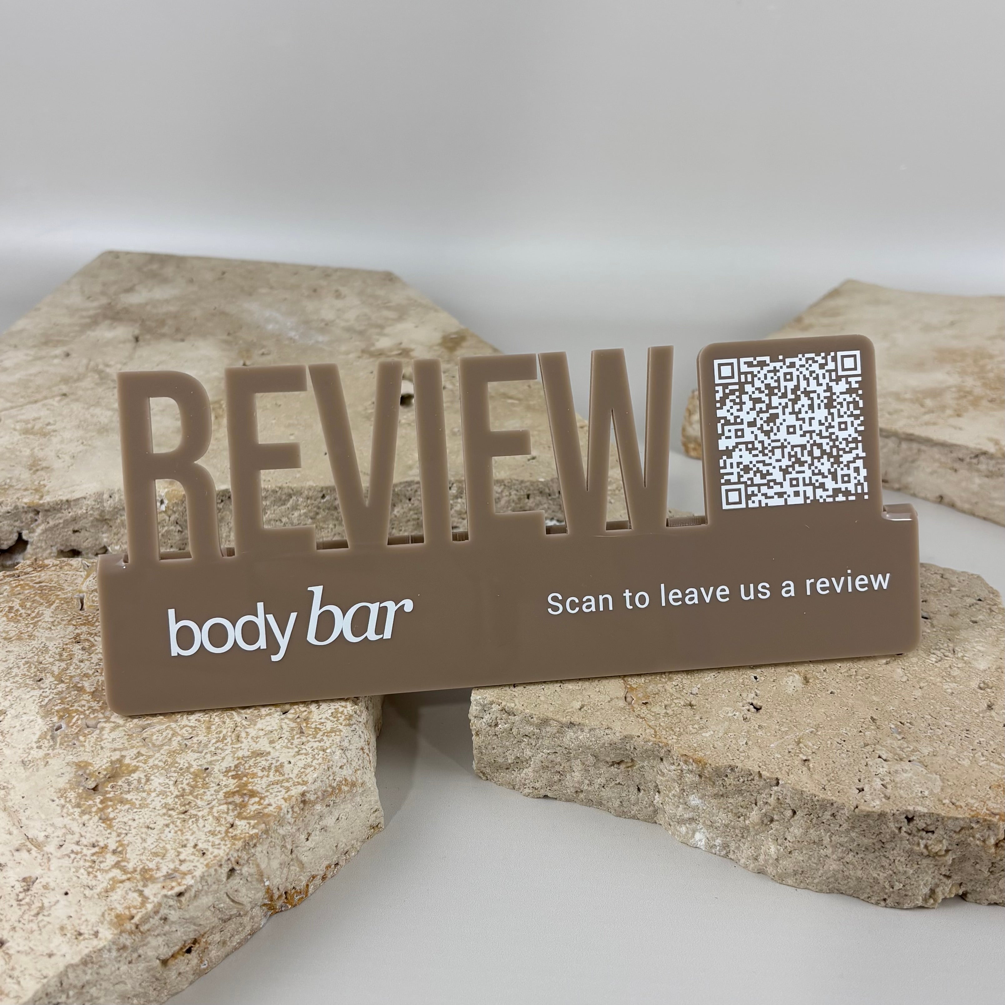 Custom Google review QR code stand with business logo, personalised acrylic countertop review sign for salons, beauty clinics, retail stores and small businesses.