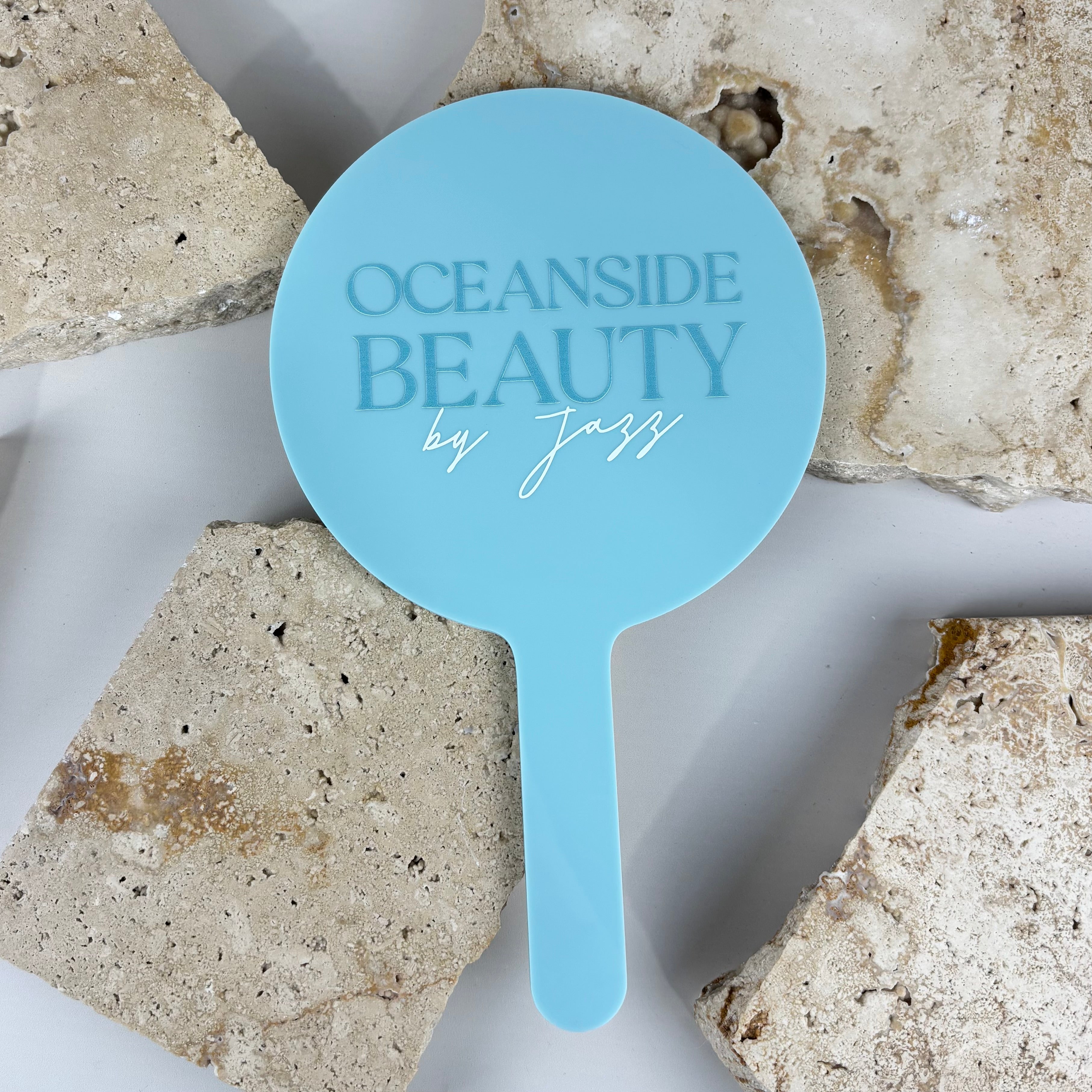 Custom round acrylic handheld mirror with engraved logo, frosted blue salon mirror with white detailing, branded beauty mirror for hairdressers and makeup artists, personalised business mirror Australia