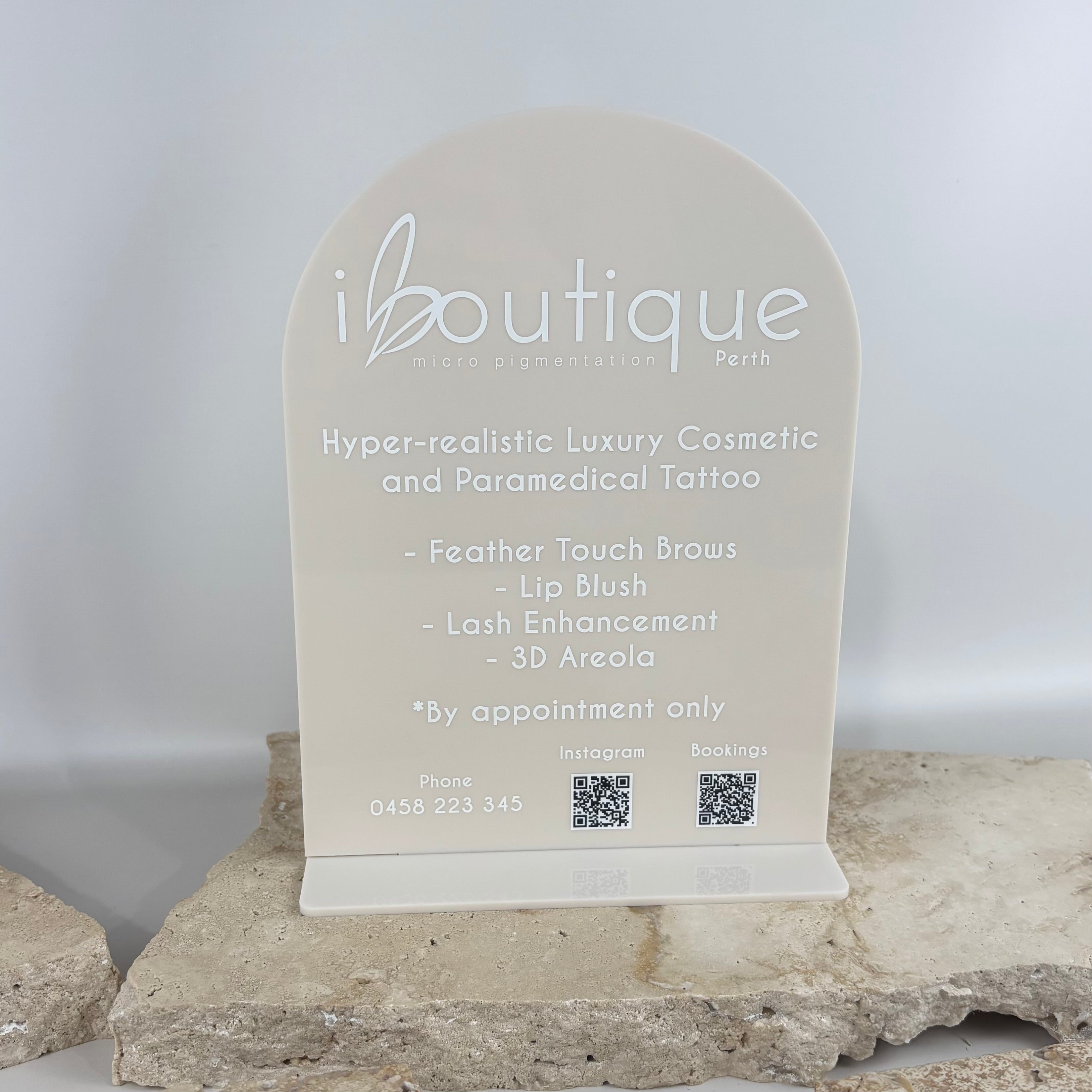 Custom acrylic counter display stand with logo and QR codes for beauty clinic reception desk