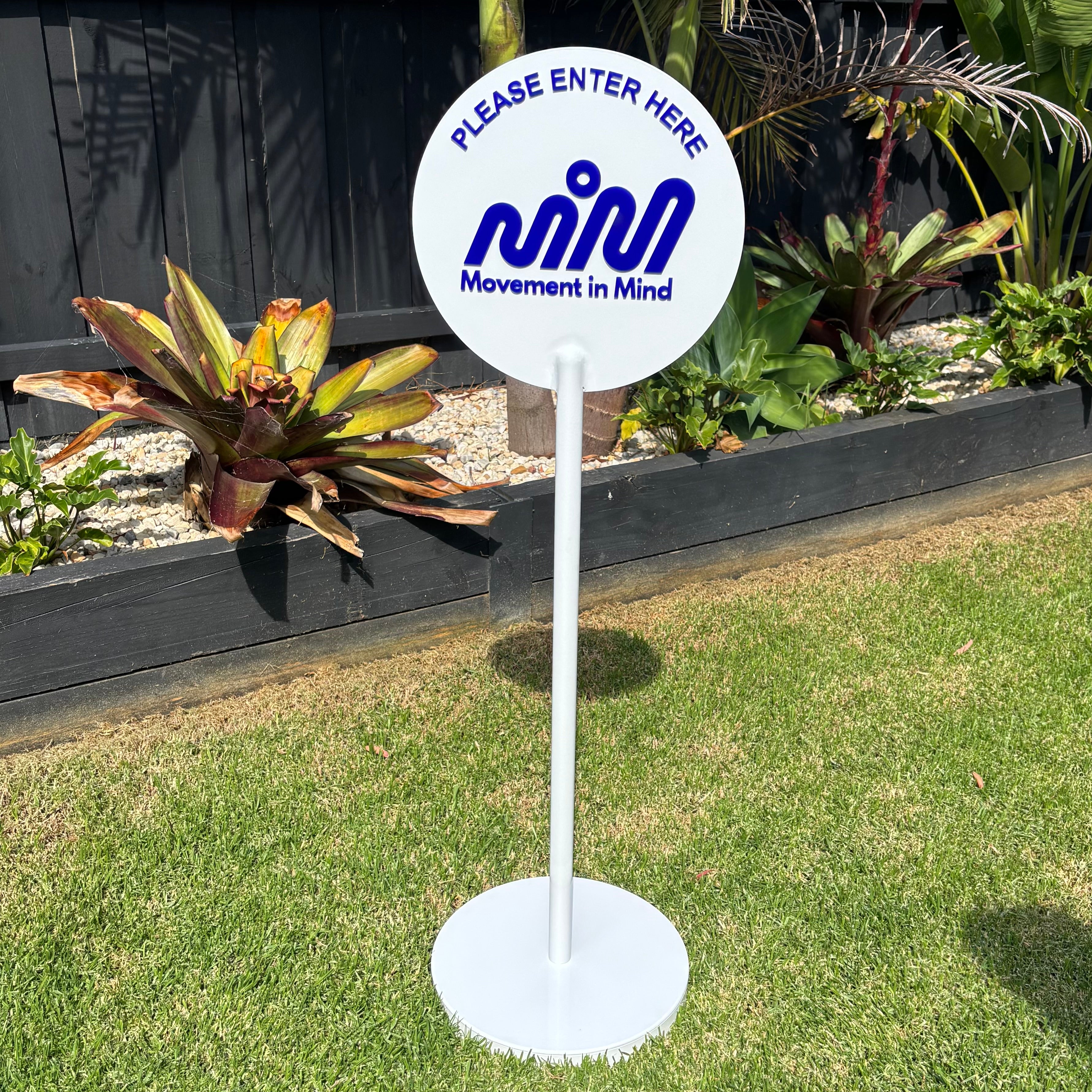 Custom metal floor sign stand with round panel and 3D acrylic logo, outdoor business advertising sign, freestanding signage for entry direction and branding display