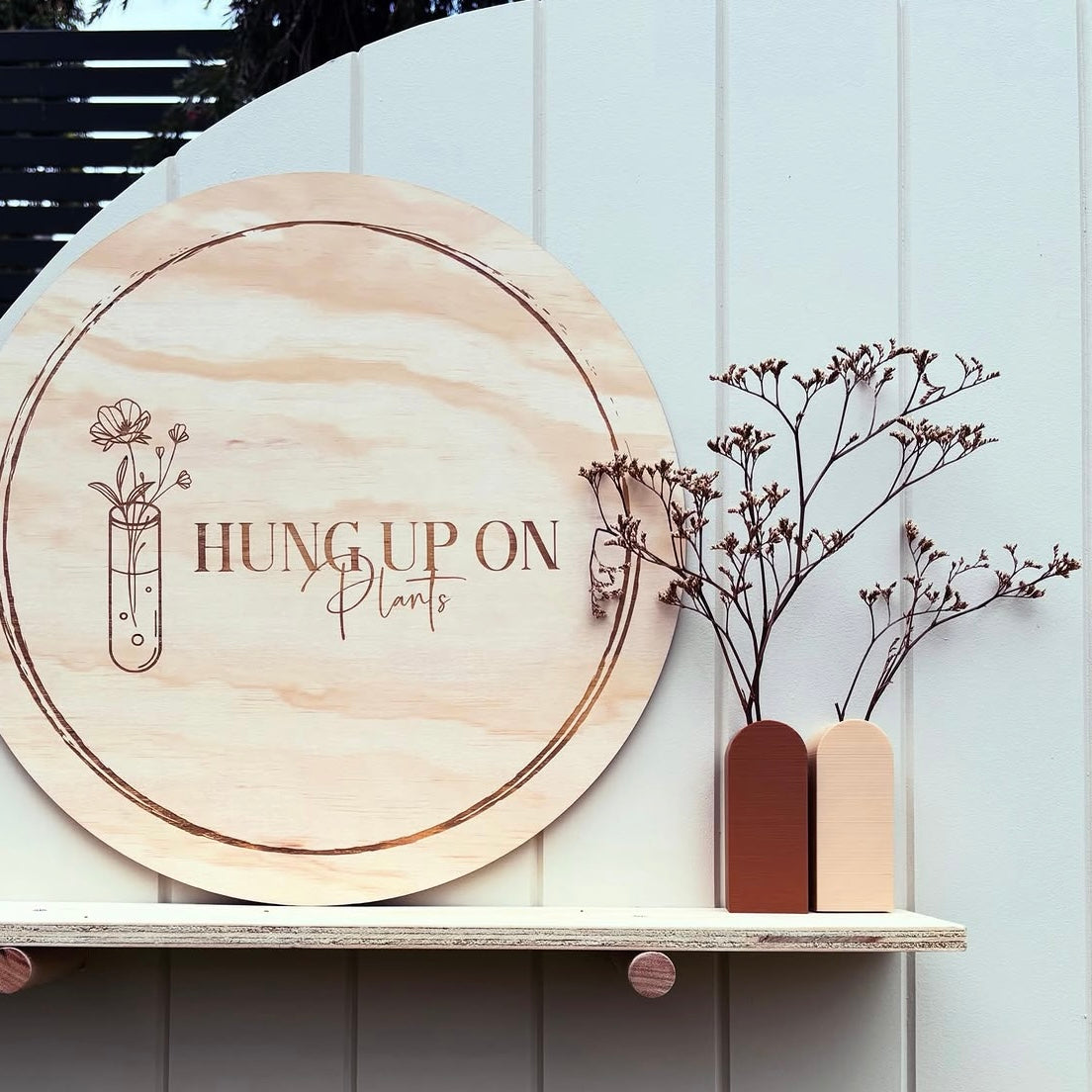 Custom engraved round timber business sign for plant shops and small businesses, personalised wooden logo sign with natural rustic finish for market stalls and storefront branding