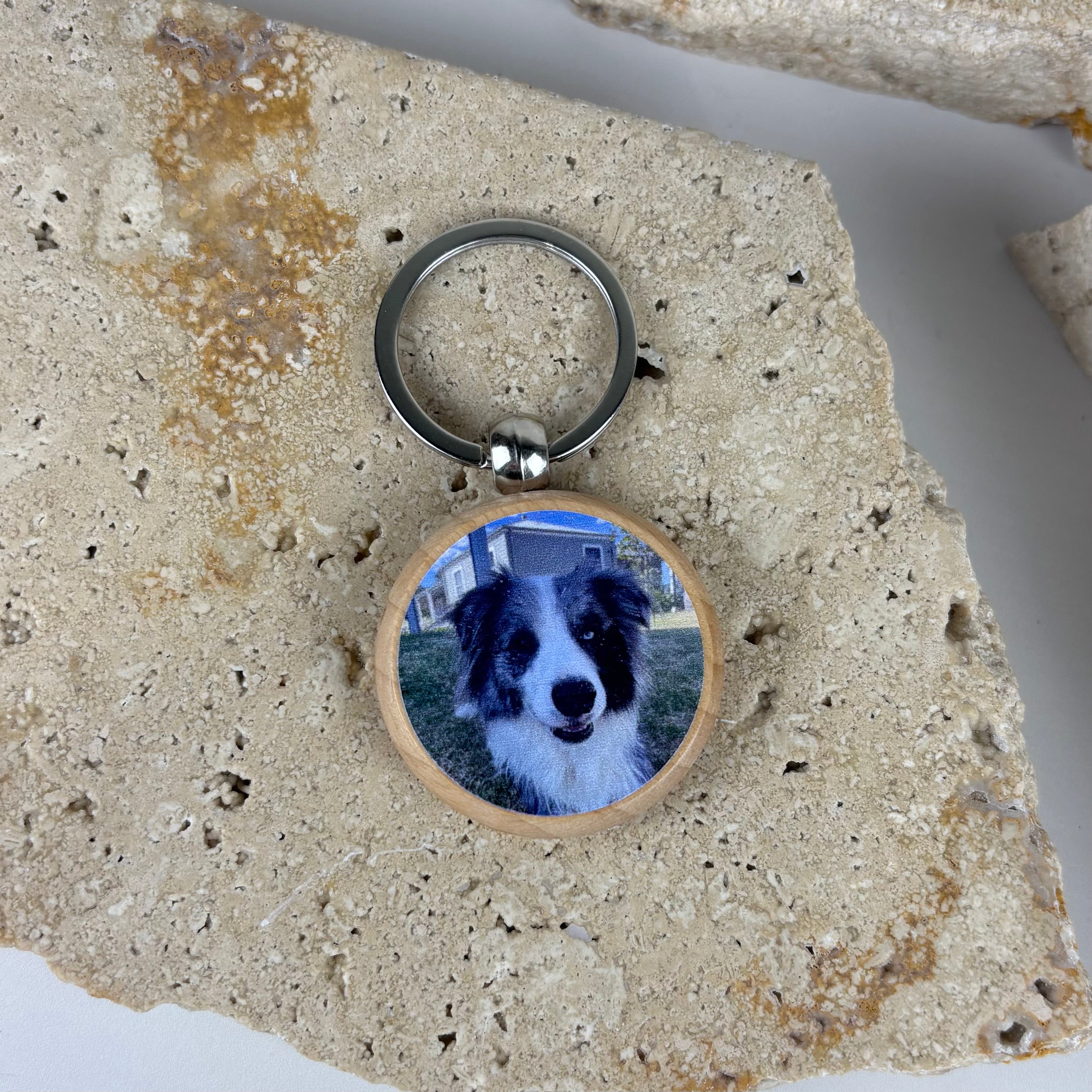 Personalised round timber photo keyring featuring a dog portrait on the front with engraved text on the back, custom pet memorial keychain designed for dog lovers and personalised gift ideas.