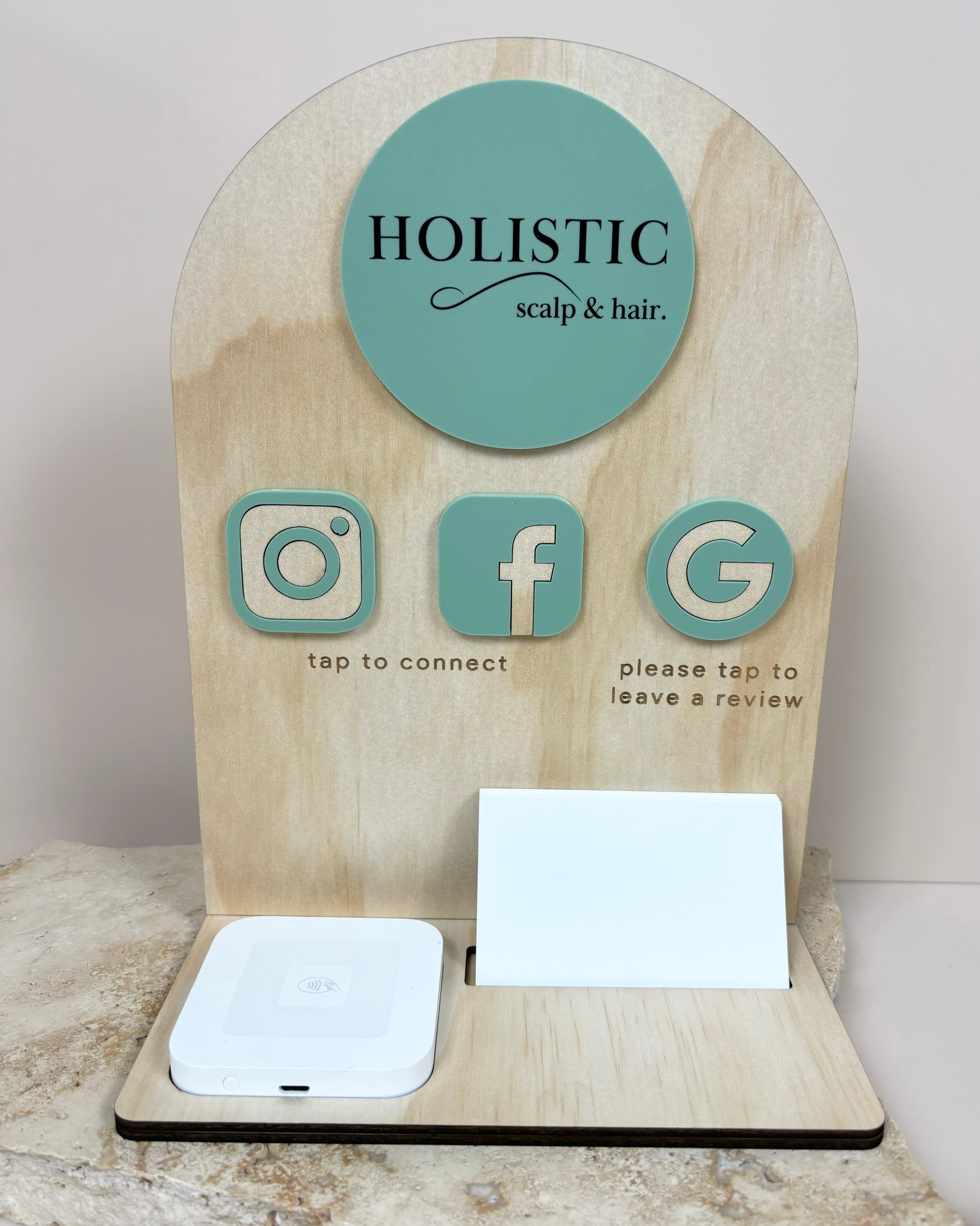 Wood finish NFC business station with square dock – Holistic salon branding with Instagram, Facebook and Google icons.