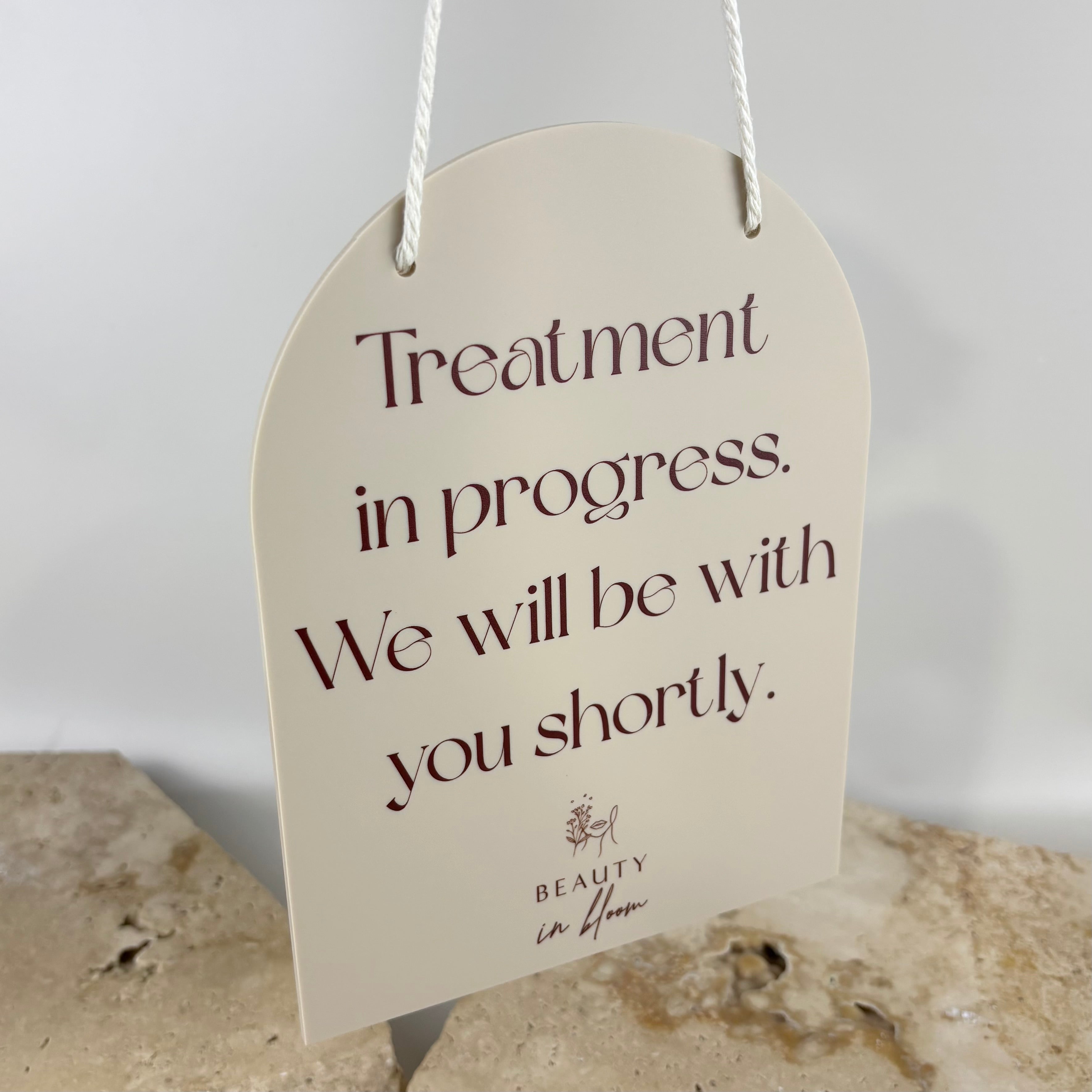 Custom acrylic hanging door sign for beauty salon, arch shaped cream acrylic sign with rope hanger, “treatment in progress” message, modern clinic door signage, aesthetic salon signage Australia